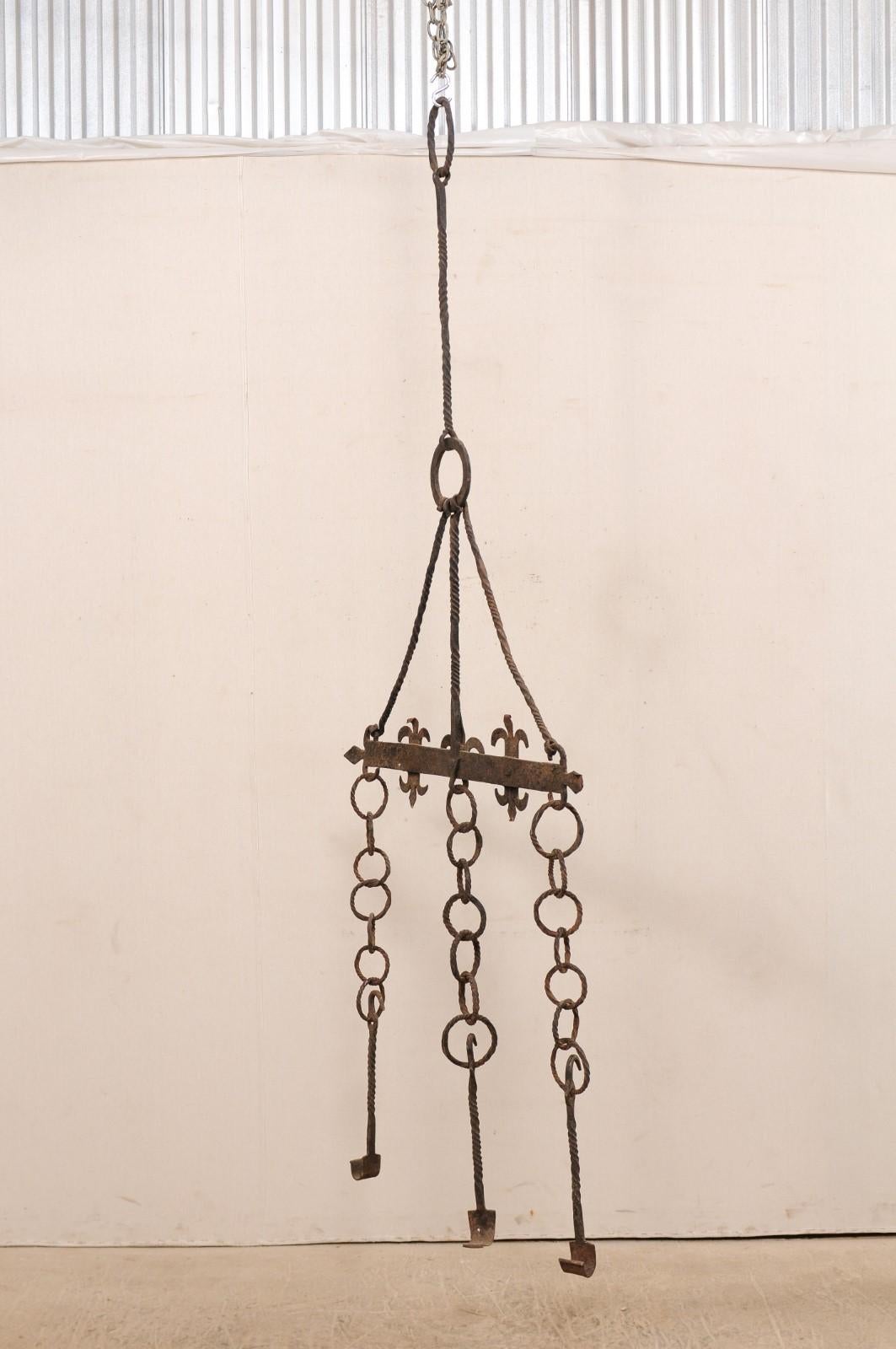 Patinated 18th Century French Hanging Iron Fireplace Accessory For Sale