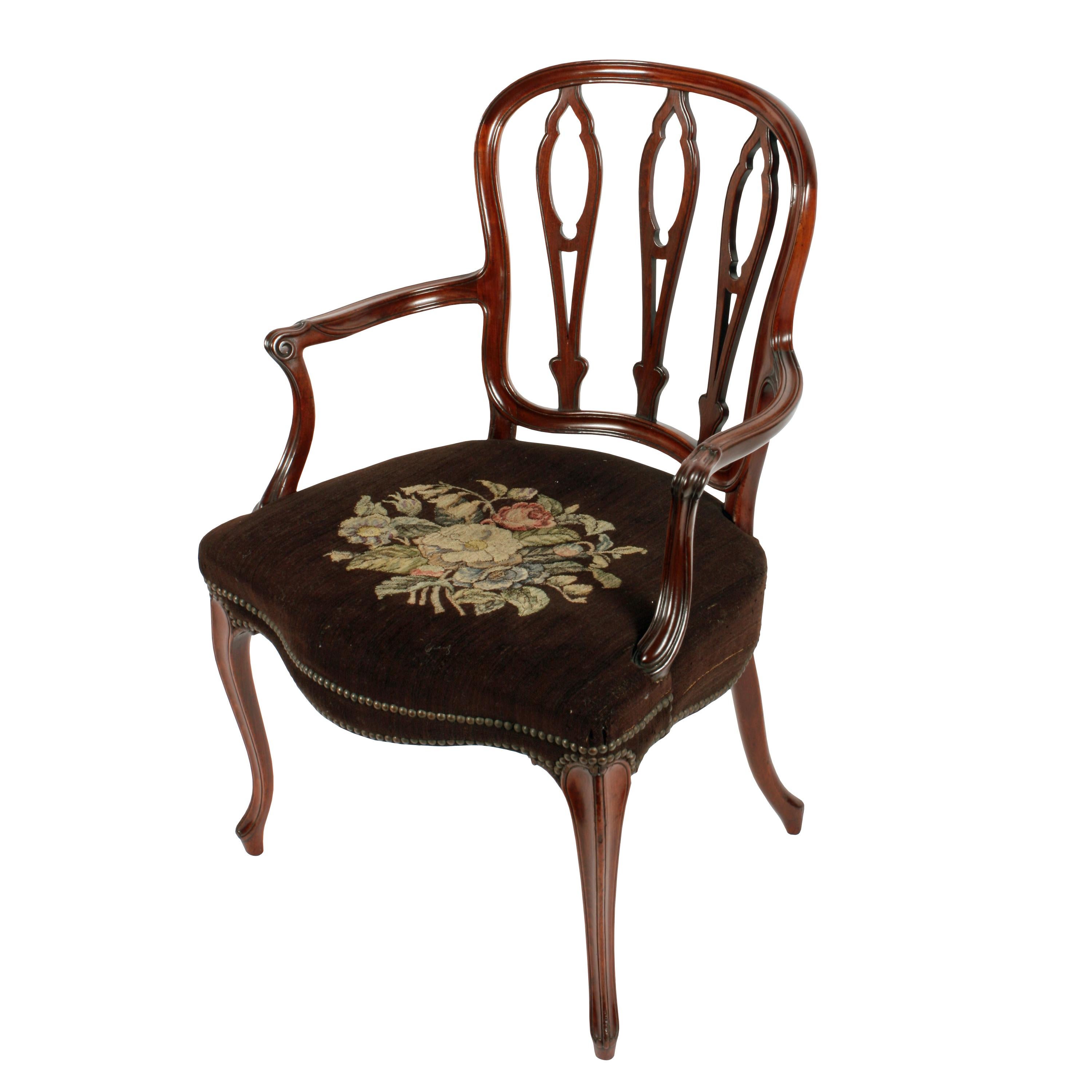 18th century French Hepplewhite armchair


An 18th century George III mahogany French Hepplewhite armchair.

The chair has a broad upholstered seat with a serpentine front and carved cabriole shaped legs.

The back has three pierced splats,