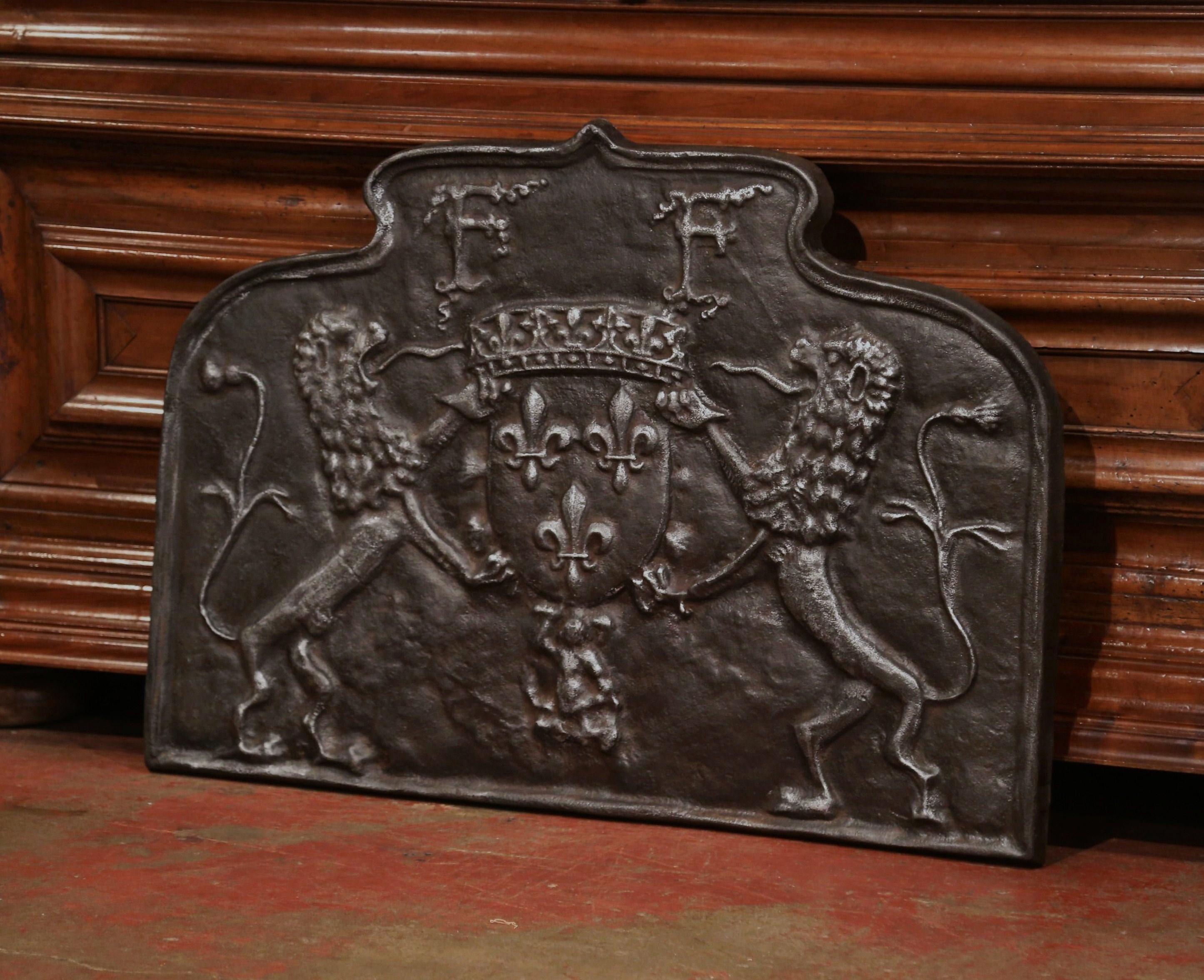 Add rustic flair to your kitchen with this large, antique fire back. This 18th century French iron plaque could be used at the back of your fireplace, or as a backsplash behind your kitchen stove. Created in France, circa 1780, the iron plaque has a