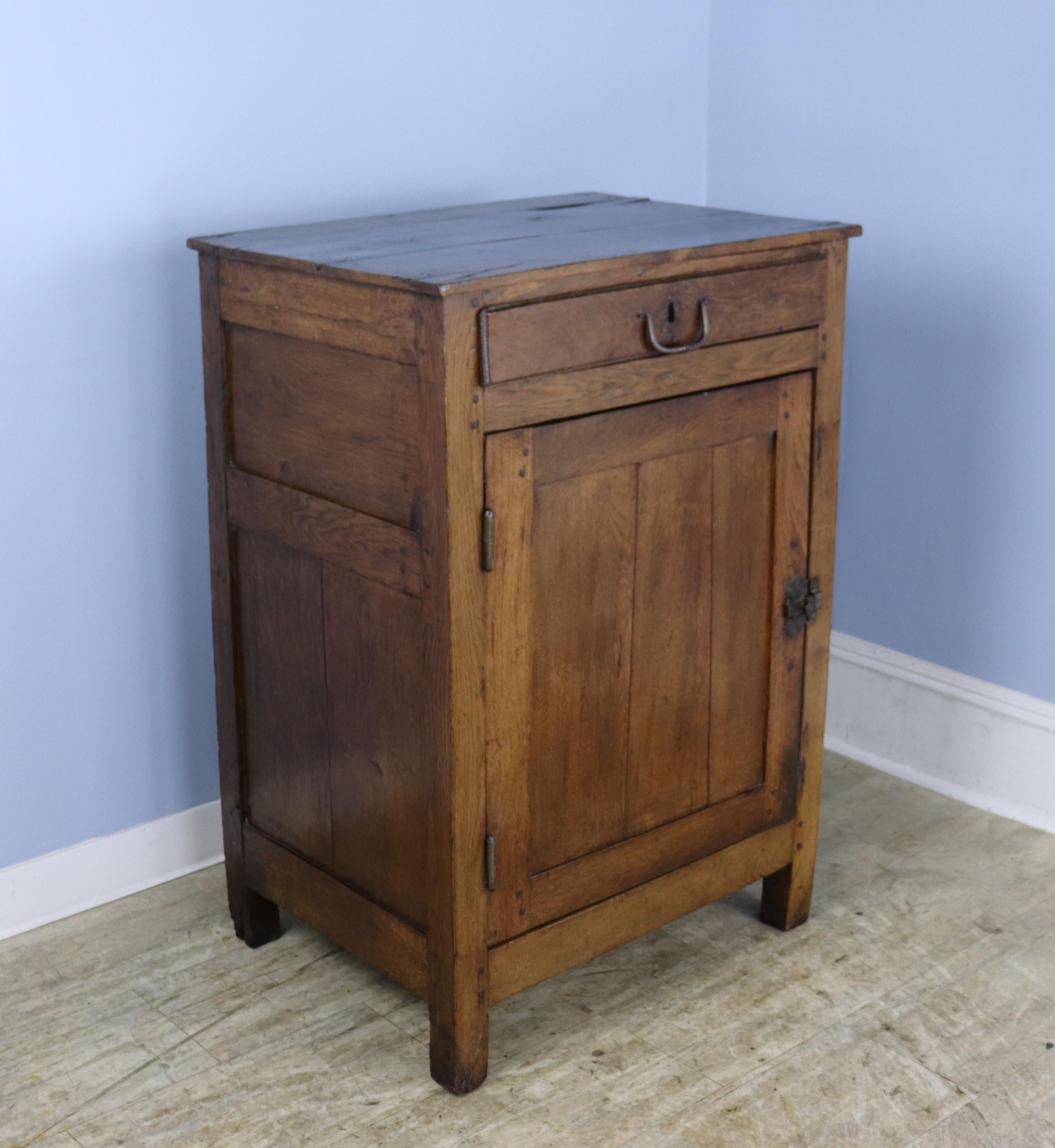 A handsome early French jamming cupbord, originally used for kitchen storage and still in very nice antique condtion.  Good interior storage with one center non-adjustable shelf and a roomy drawer overhead.  The oak has great color and patina and