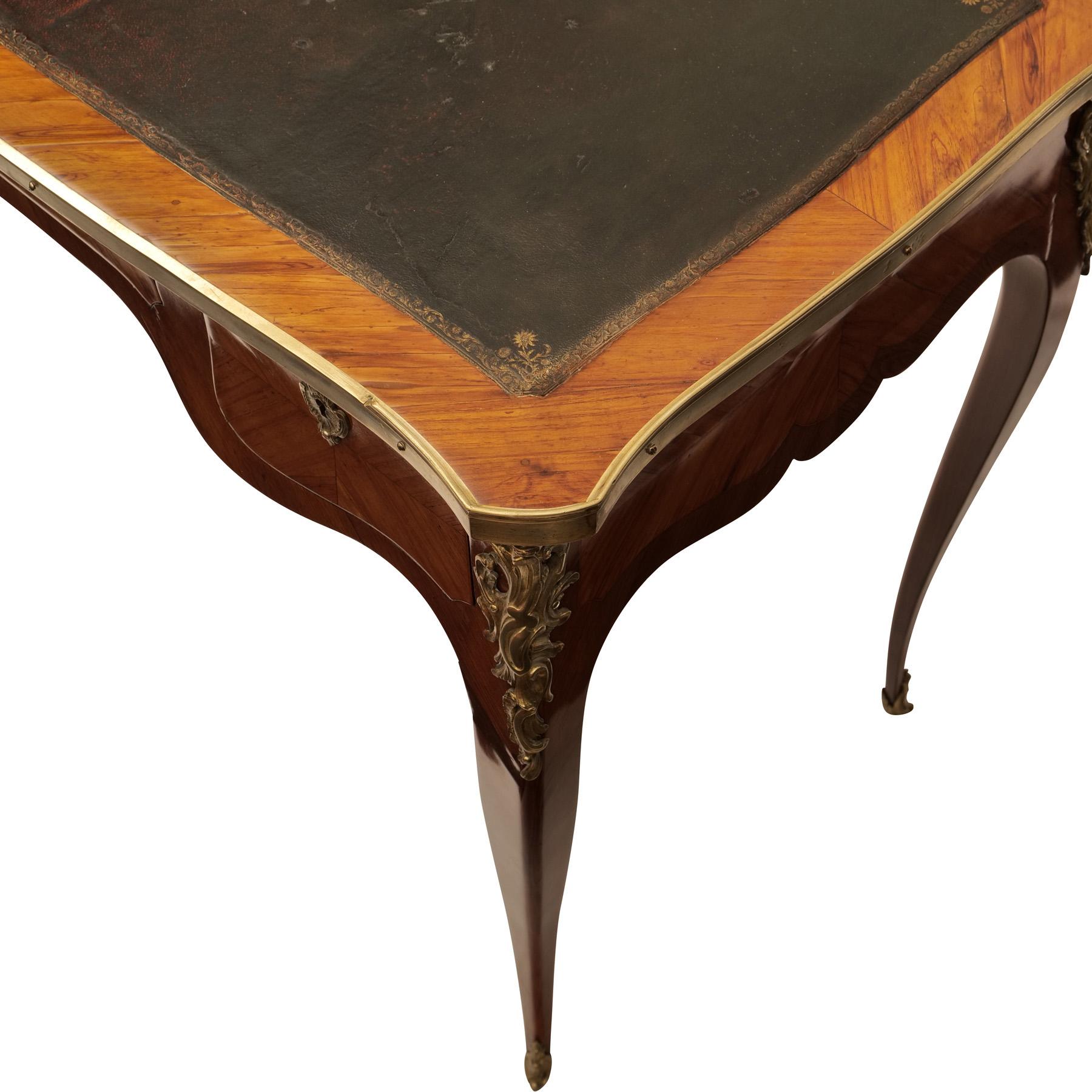 Ornamental lady's secretary, France around 1770, rosewood veneered, leather overlay, brass edging and metal appliques, 3 drawers, shellac-wax polish

height: 75 cm, width: 94,5 cm, depth: 55 cm