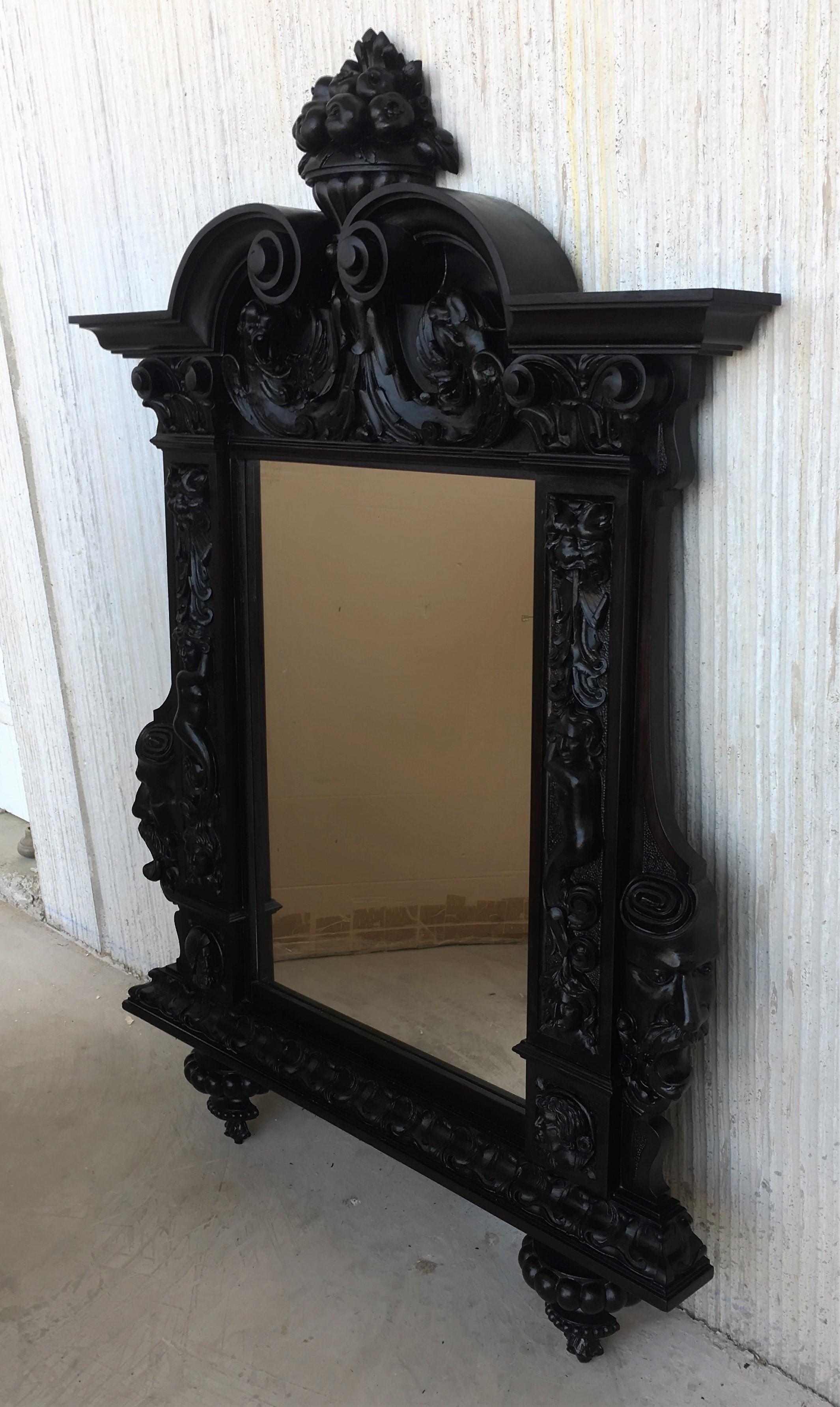 18th century large Flemish baroque walnut ebonized mirror
Very decorative impressively carved mirror in the typical Flemish manner.
 
