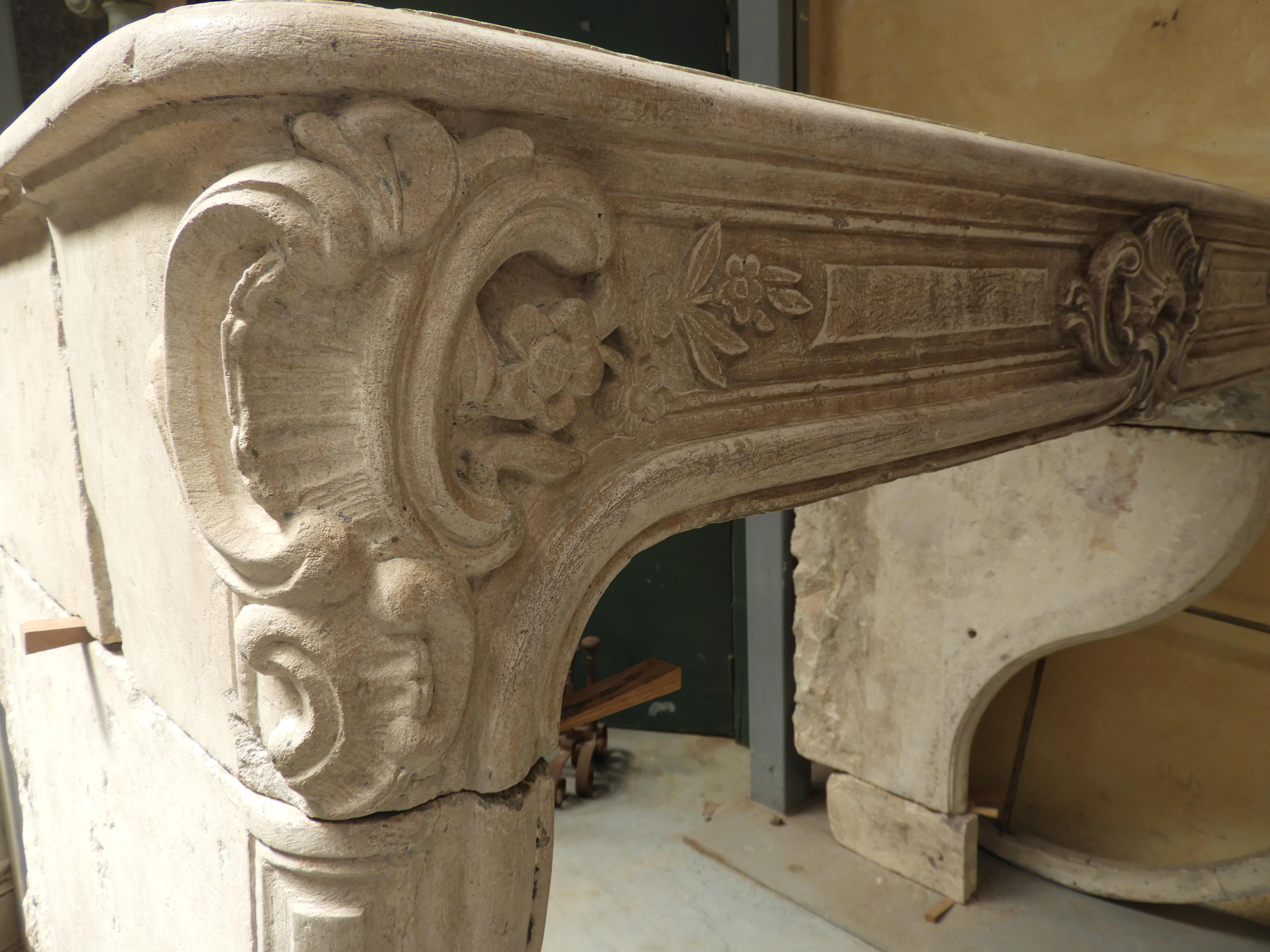 Hand-Carved 18th Century French Limestone Louis XV Fireplace For Sale