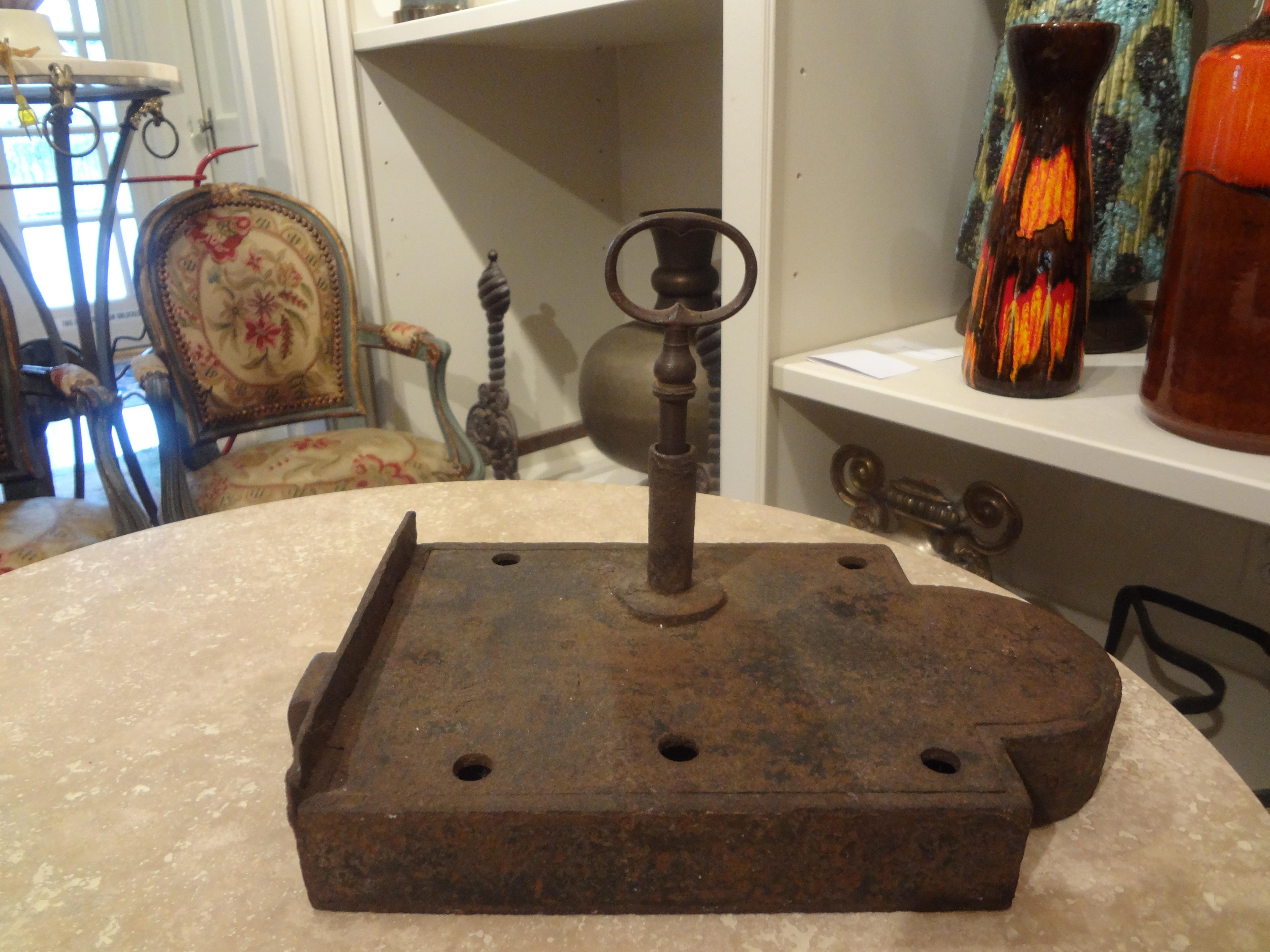 Large 18th century French iron lock and key. This handsome french iron lock comes with the original key and makes an interesting coffee table accessory or paperweight.
