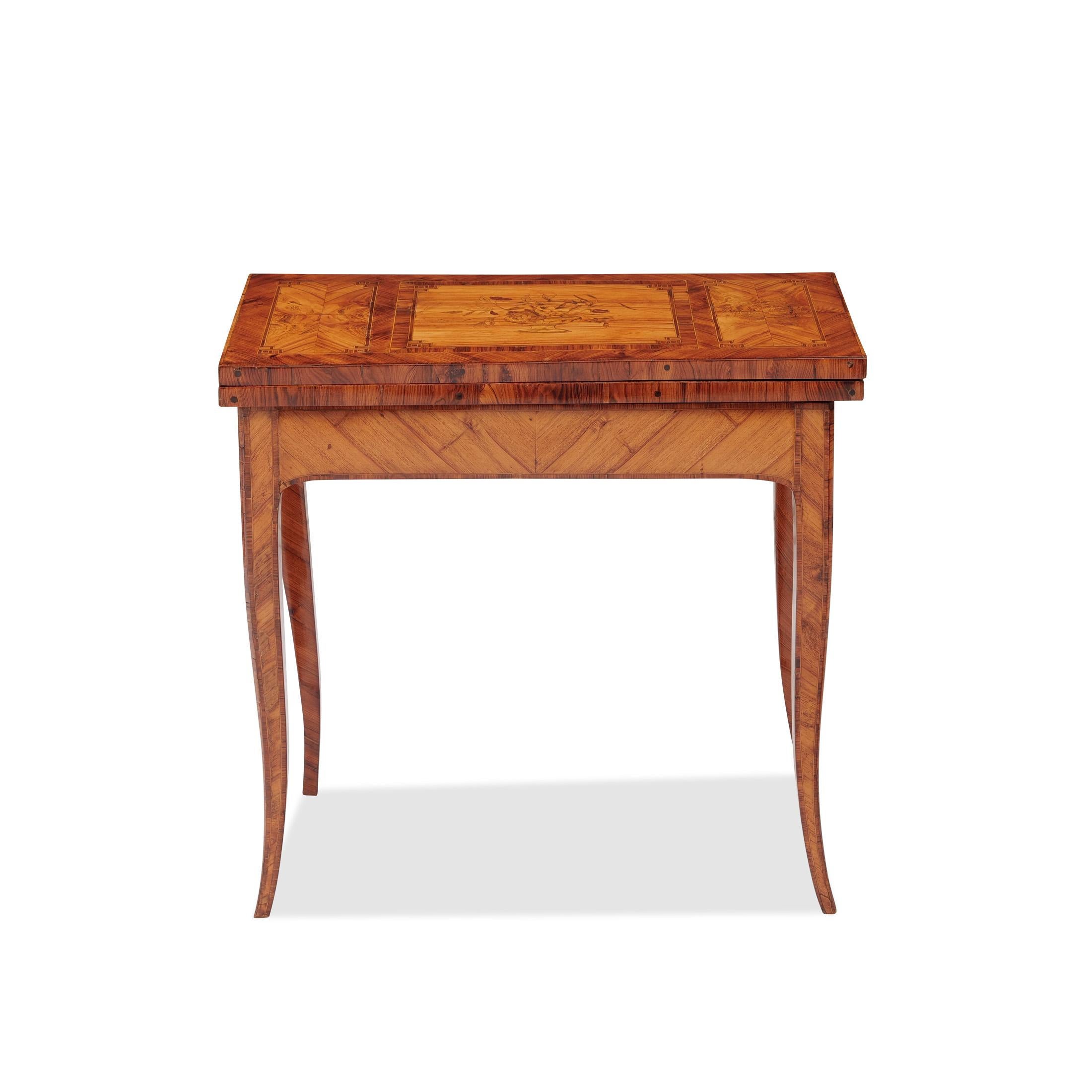 Louis Quinze console
France, Louis-Quinze circa 1760, rosewood and rosewood veneer and marquetry, top with lush inlays in floral motifs, fine ribbon inlays, slightly flared square legs, hinged, green felt interior. Shellac hand polish

Dimensions: