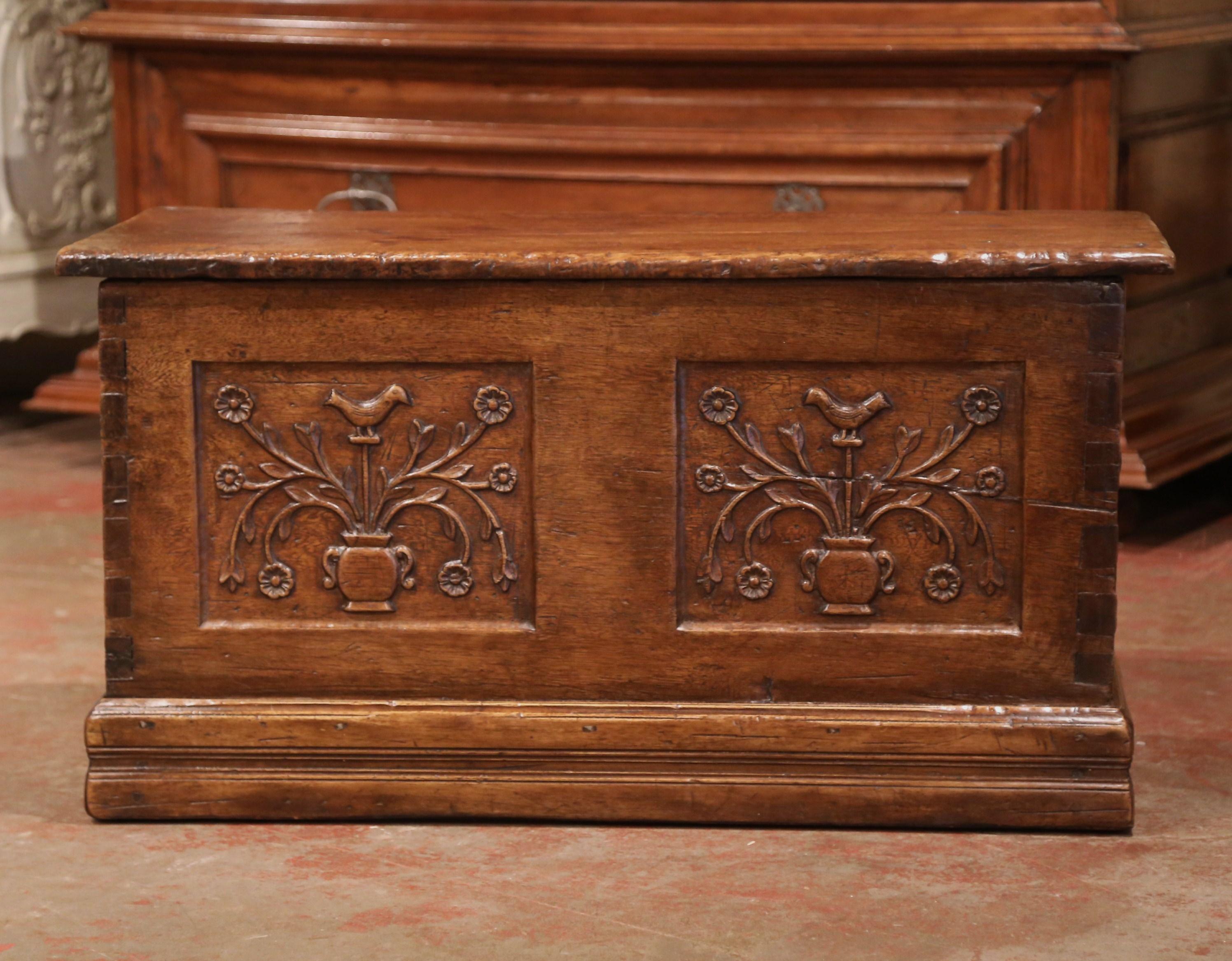 Store your winter blankets in this antique fruitwood trunk. Crafted in the Pyrenees mountains (southwest France) circa 1780, and sited on a decorative bottom plinth, the chest has the original forged hinges in the back and opens up from the top. The