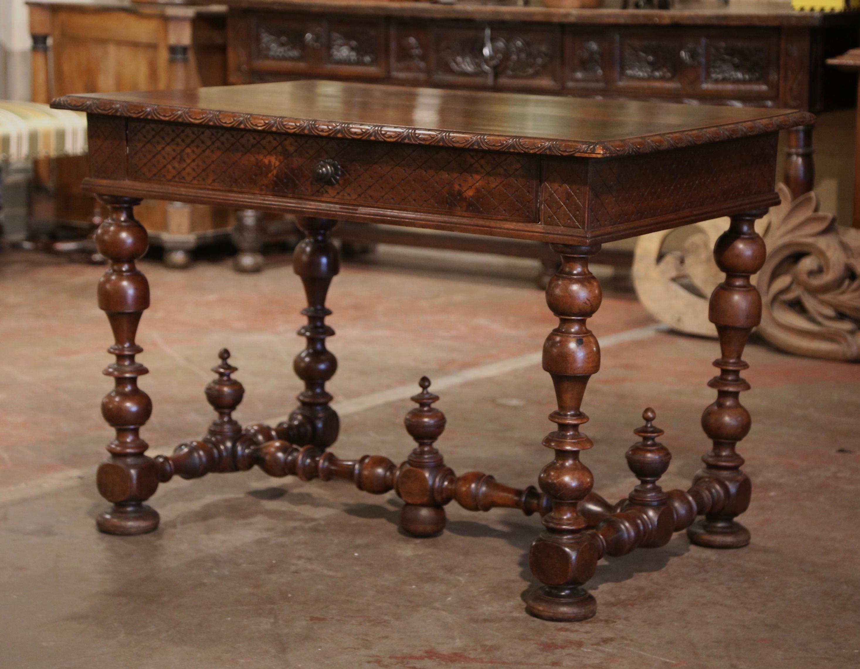 Incorporate extra, functional surface space into your living room or den with this elegant antique side table. Crafted in the Perigord region of France circa 1780, and built of walnut, the side table stands on thick turned legs ending with flat bun