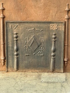 Plaque de cheminée / dosseret "armoiries" Louis XIV du XVIIIe siècle
