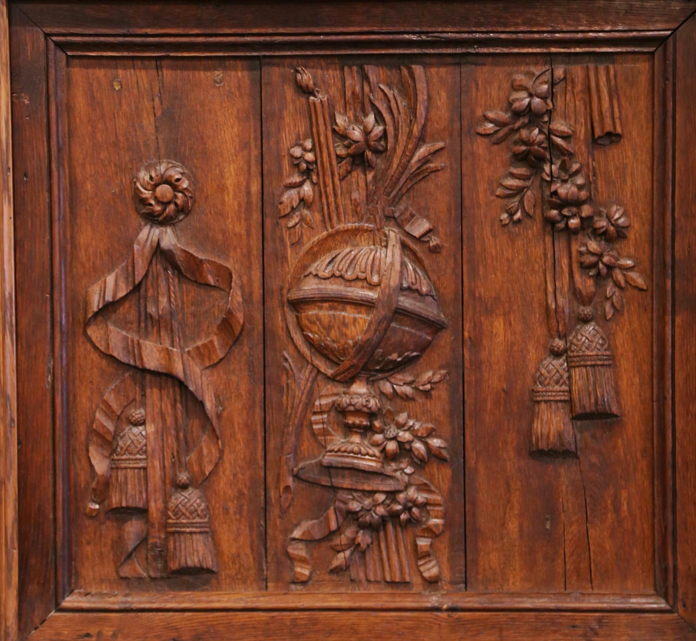 Decorate a man's office with this elegant antique carving. Crafted in France circa 1770, and almost square in shape, the sculpted element is decorated with exquisite carvings in high relief including a world globe on stand, floral and tassels