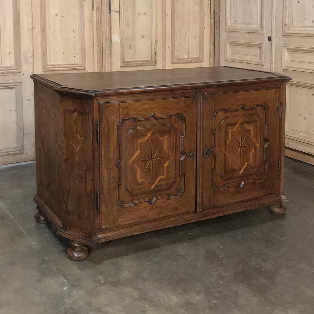 18th Century French Louis XIV Inlaid Buffet is a wonderful example of talented hand-crafted cabinetry!  Utilizing indigenous white oak as the primary casework, the artisans who produced this master work created the form with boldly mitered