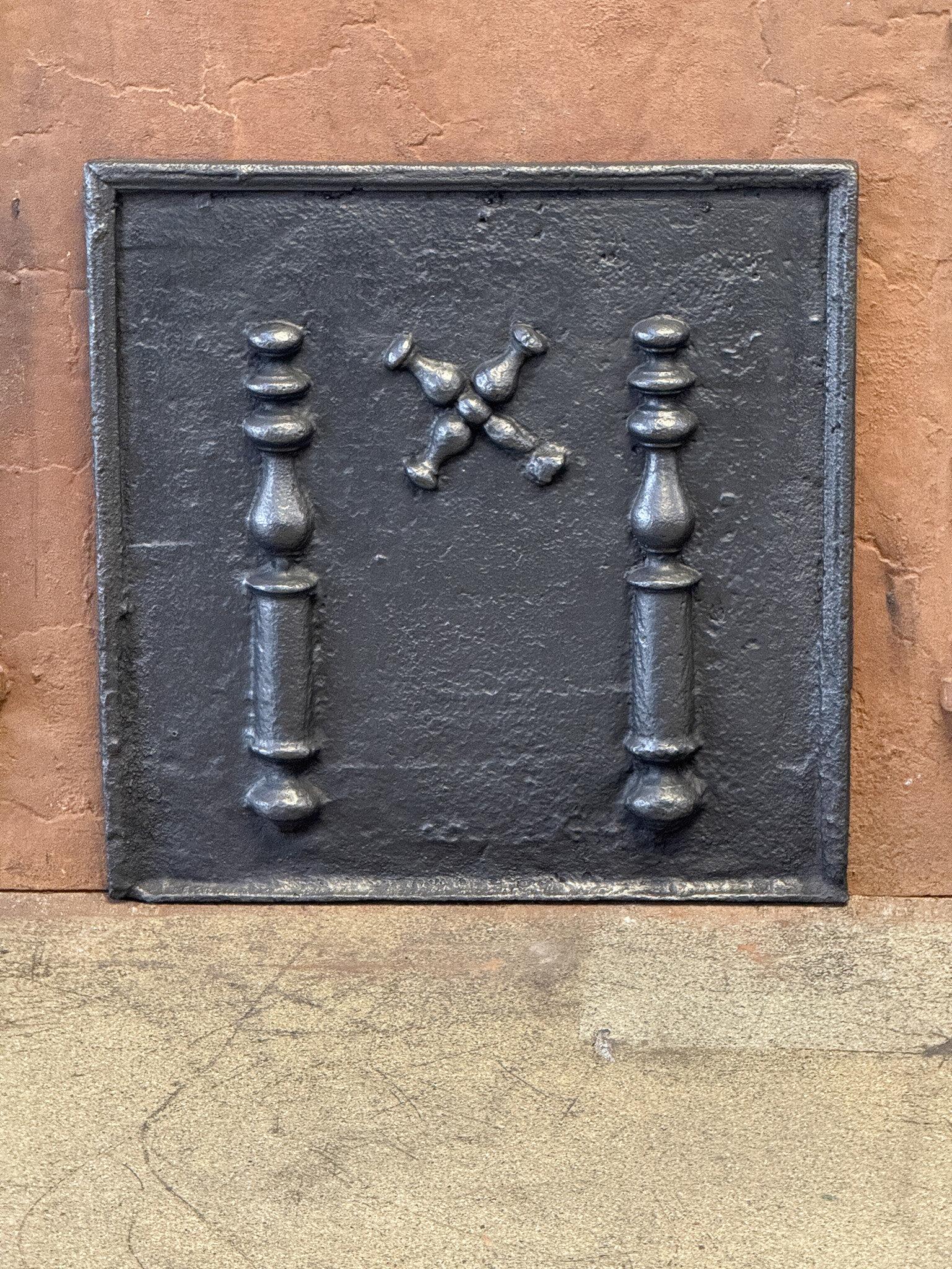 Beautiful 18th century French fireback with a Saint Andrew's cross and two pillars of Hercules. Saint Andrew is said to have been martyred on a cross in this shape. The cross is since then a sign for humility and sacrifice. The pillars of Hercules