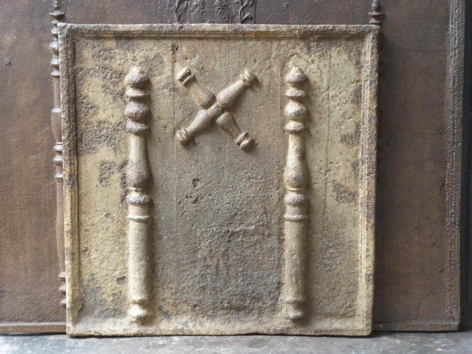 Beautiful 18th century French fireback with a Saint Andrew's cross and two pillars of Hercules. Saint Andrew is said to have been martyred on a cross in this shape. The cross is since then a sign for humility and sacrifice. The pillars of Hercules