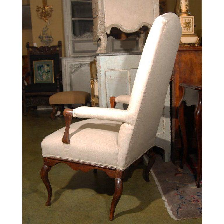 Rare and unusual French Louis XIV walnut side chair, armchair or fauteuil upholstered in linen. This versatile chair would work well as a desk chair or accent chair in many settings.