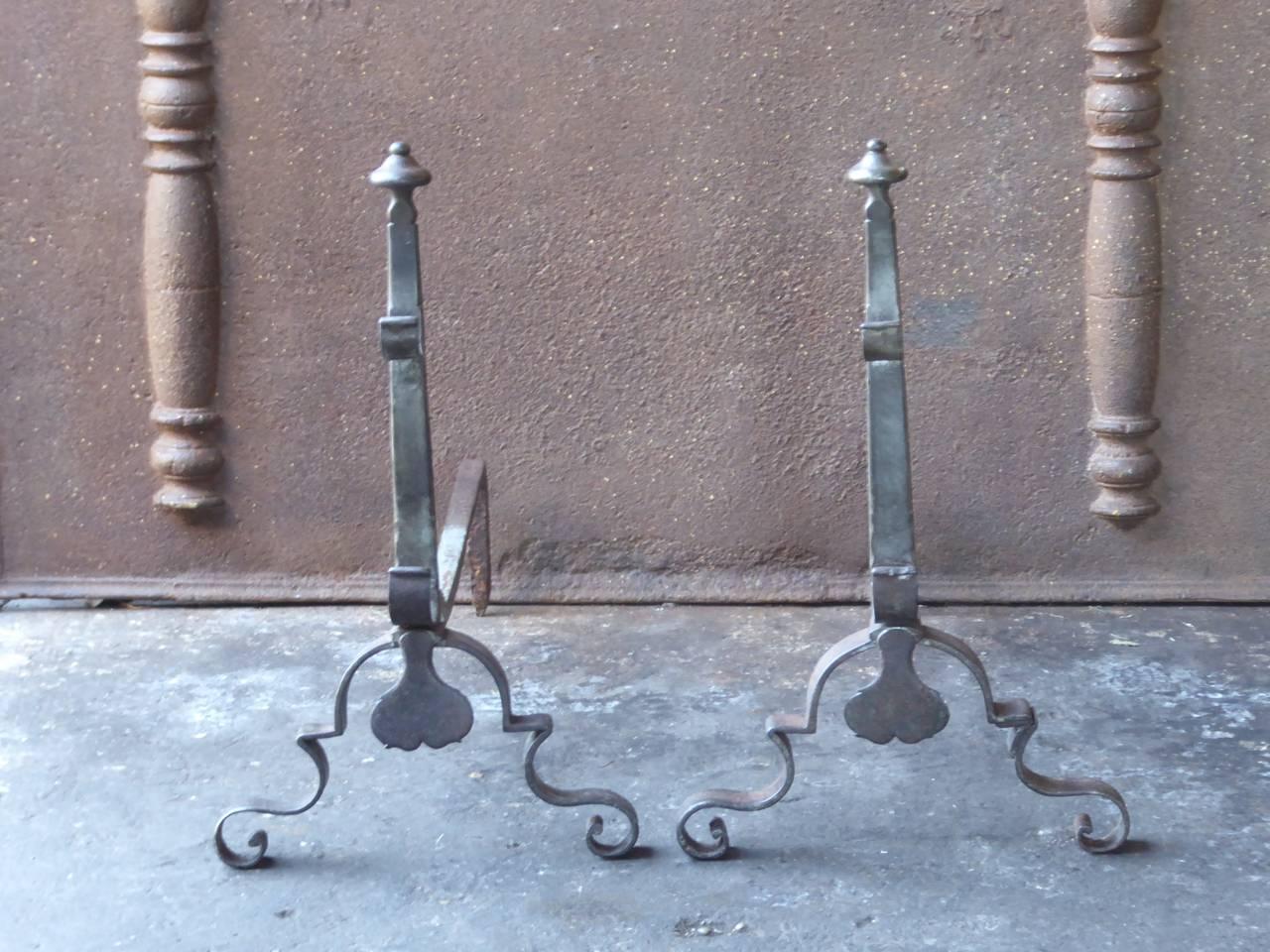 18th century French Louis XV andirons made of wrought iron. The andirons have spit hooks to grill food.

The condition is good.