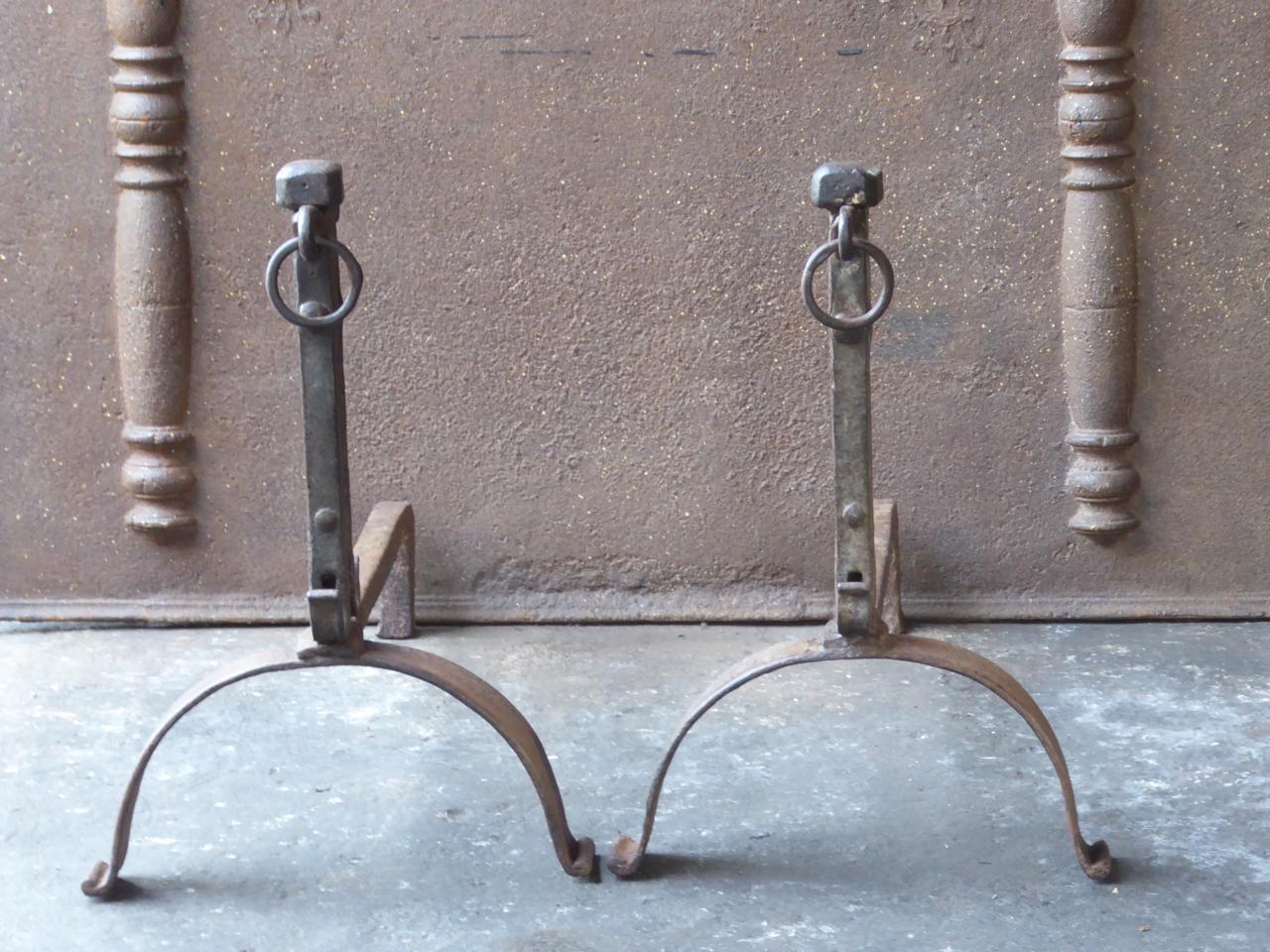 18th century French Louis XV andirons made of wrought iron. The andirons have spit hooks to grill food. The condition is good.







 