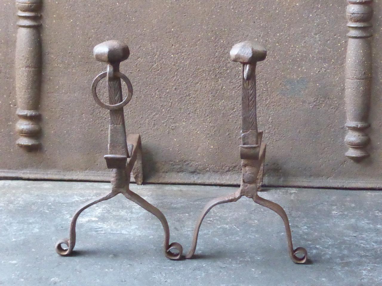 18th century French Louis XV andirons. The andirons are made of wrought iron. They have spit hooks to grill food.

We have a unique and specialized collection of antique and used fireplace accessories consisting of more than 1000 listings at