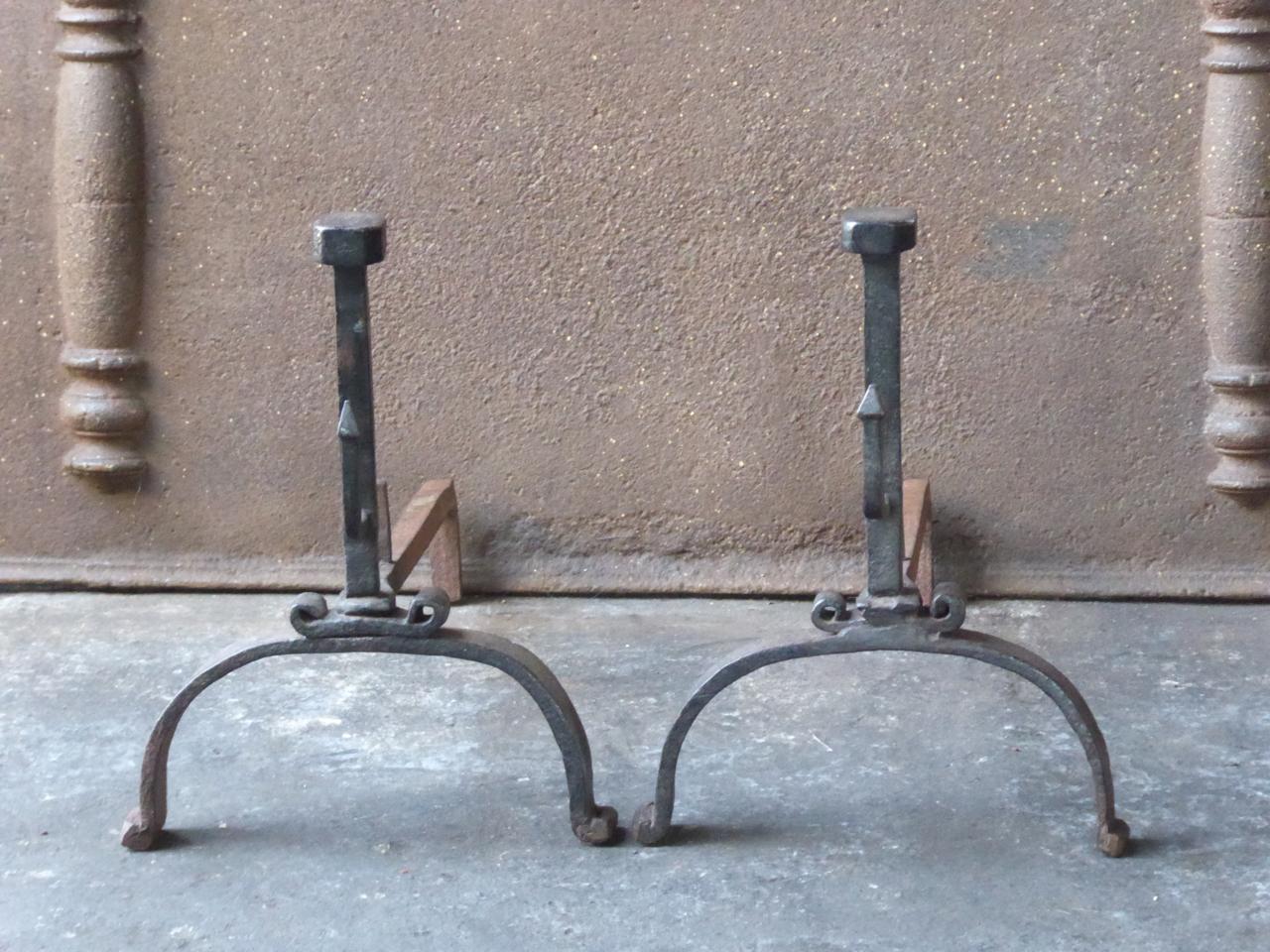 18th century French Louis XV andirons. The andirons are made of wrought iron. They have spit hooks to grill food. The condition is good.







 