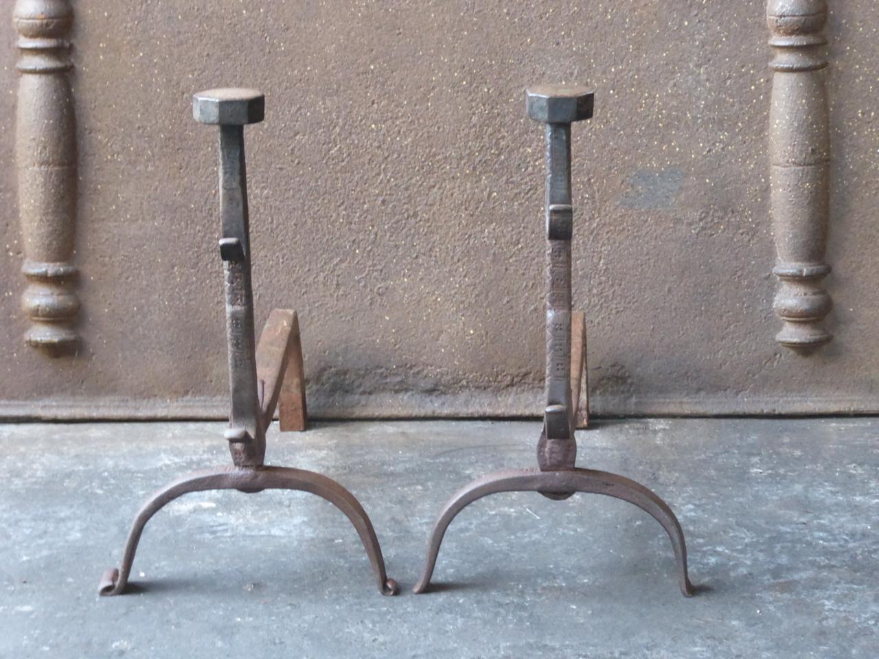 18th century French Louis XV andirons. The andirons are made of wrought iron and beautifully forged and decorated. They have spit hooks to grill food.







    