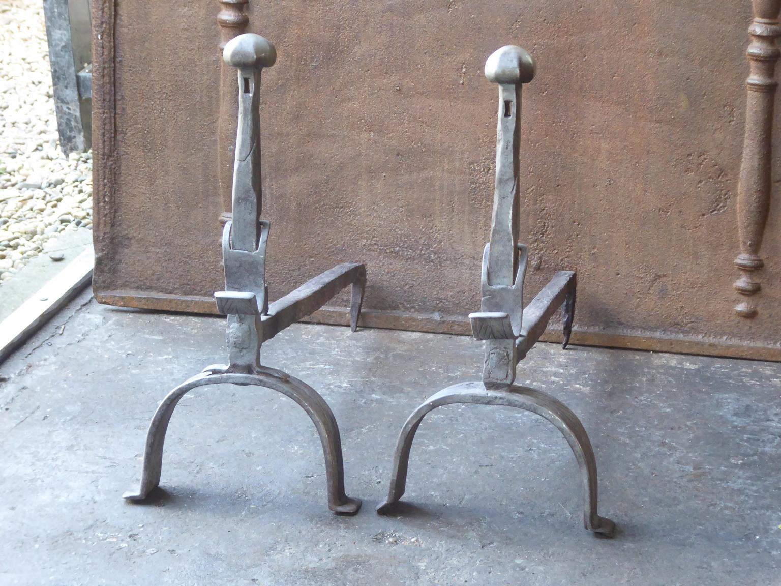18th century French Louis XV andirons made of wrought iron. The andirons have spit hooks to grill food. The andirons are beautifully carved. The condition is good.







  