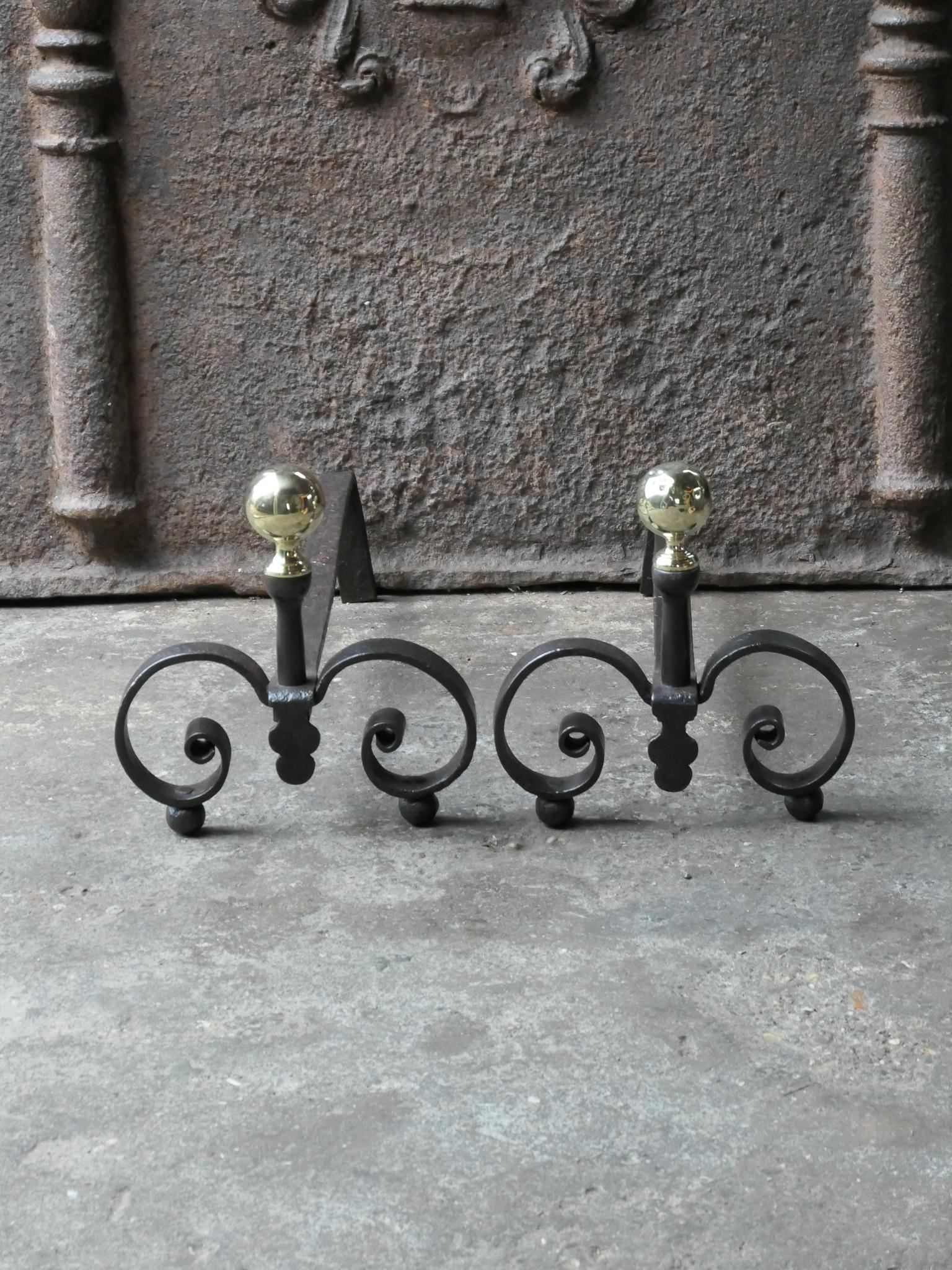 19th century French Louis XV andirons made of wrought iron with decorations made of polished brass. The condition is good. The andirons are fit for use in the fireplace.








