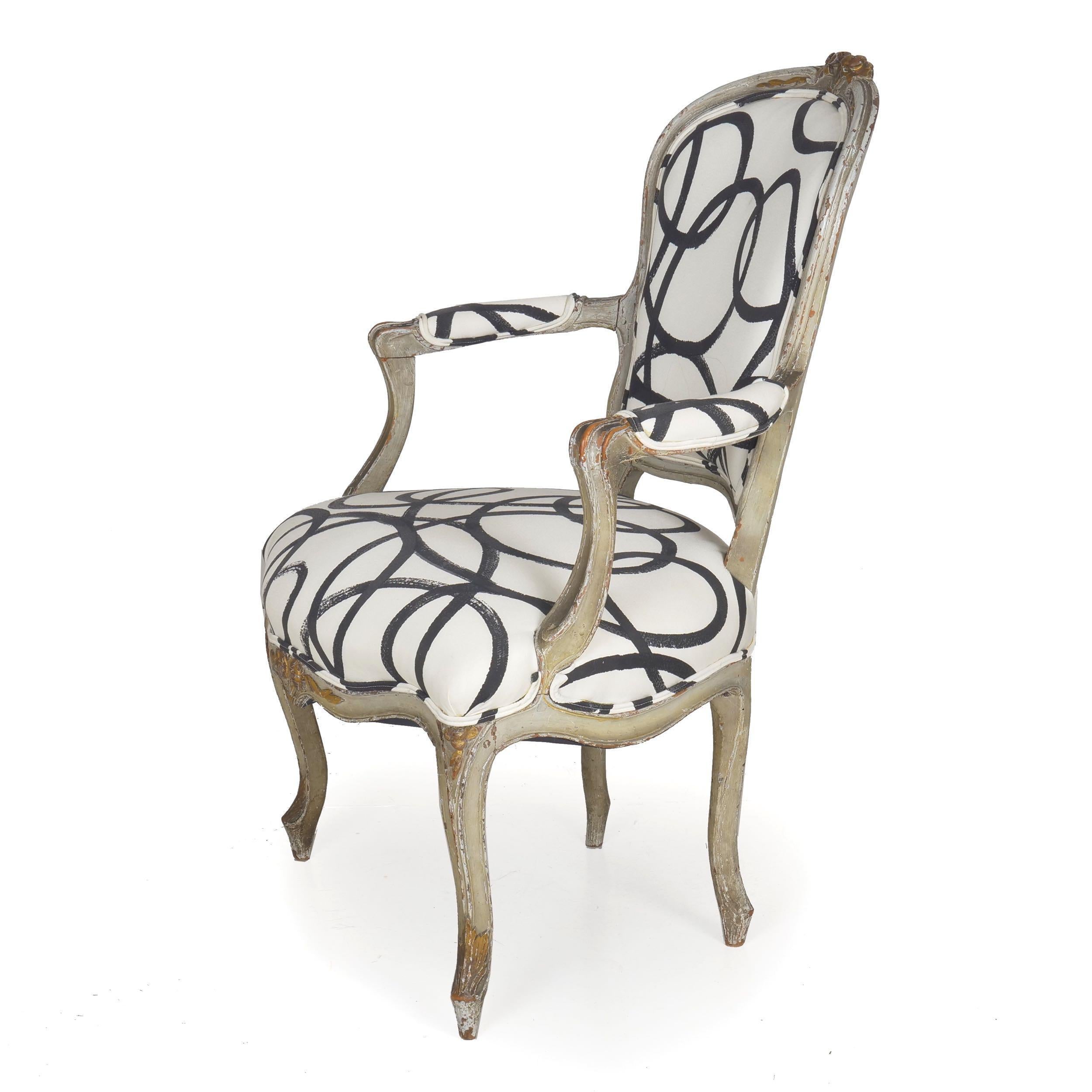 French Louis XV worn dark-gray painted fauteuil.
circa late 18th-early 19th century; with parcel gold highlights
Item # 008EXP26I-2

A gorgeous painted fauteuil of the Louis XV period, this delightful chair has a historical surface of many