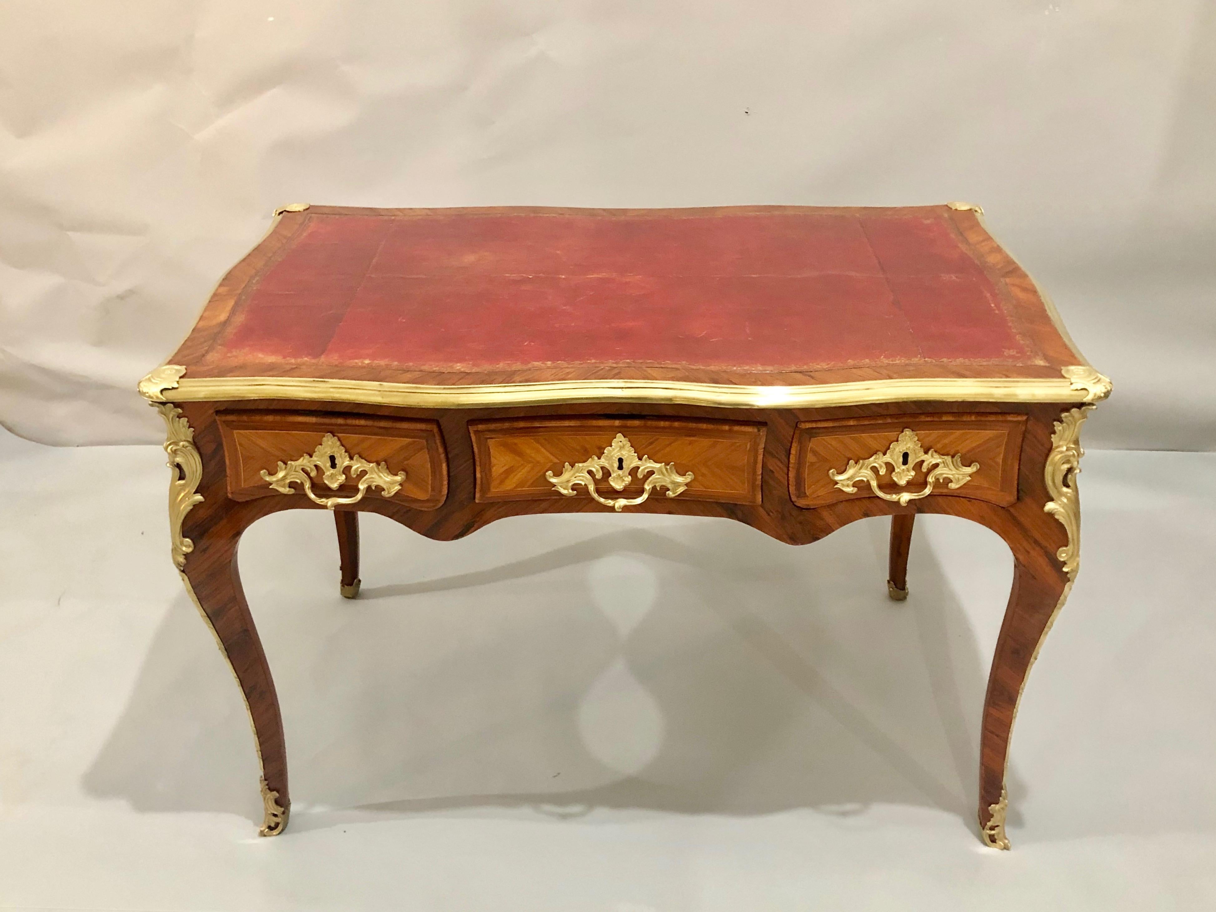 Extraordinary Louis XV style bureau plat desk by Edward Holmes Baldock, with its petite portions will fit comfortably into small spaces. 18th century bureau plats or writing tables were also called library tables as they were often found in the home