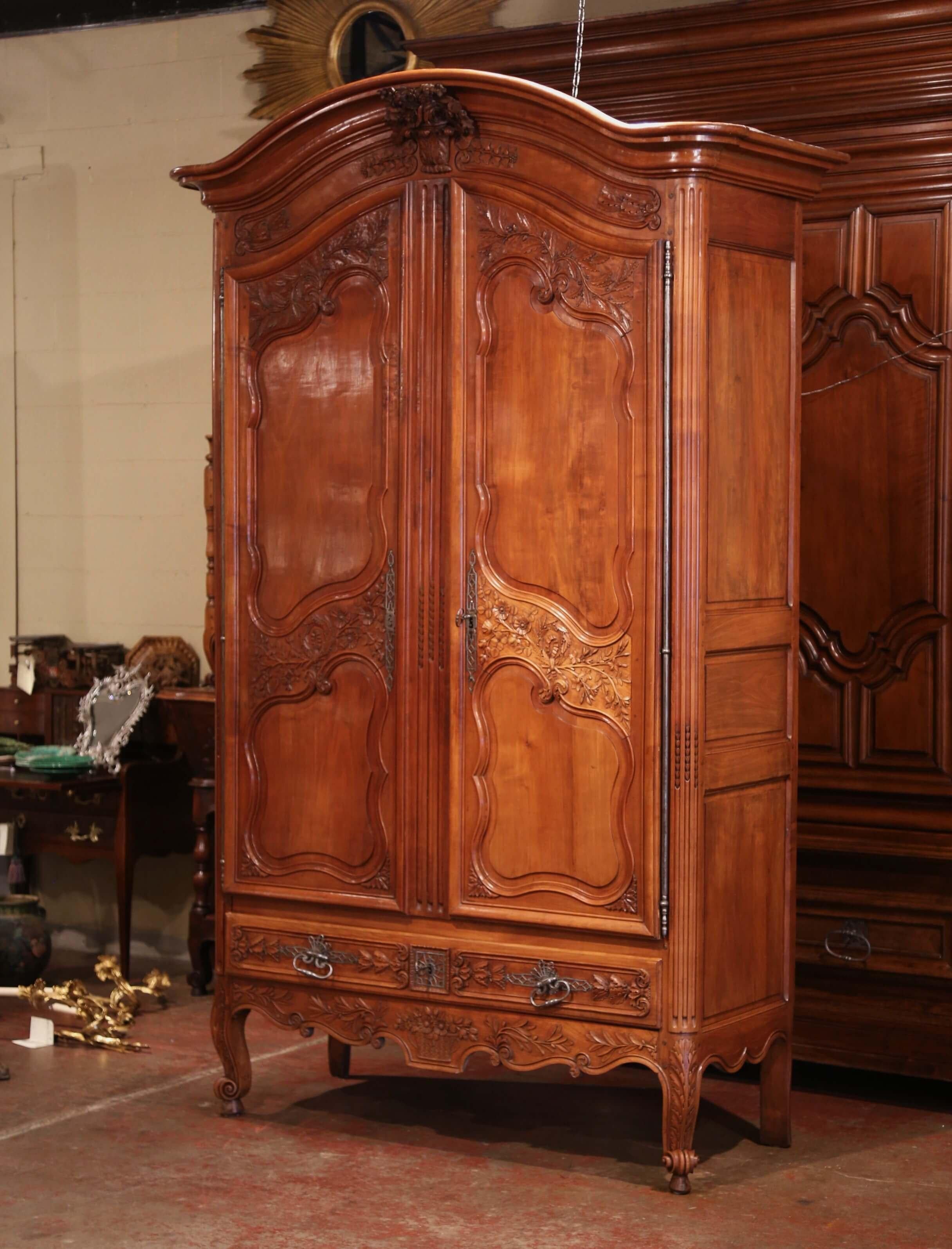 Patinated 18th Century French Louis XV Carved Cherry Two-Door Armoire from Poitou Region