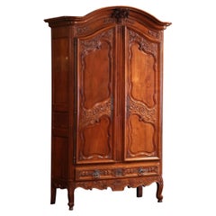 Antique 18th Century French Louis XV Carved Cherry Two-Door Armoire from Poitou Region