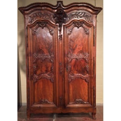 18th Century French Louis XV Carved Walnut Armoire from Lyon