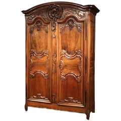 18th Century French Louis XV Carved Walnut Two-Door Armoire from Lyon