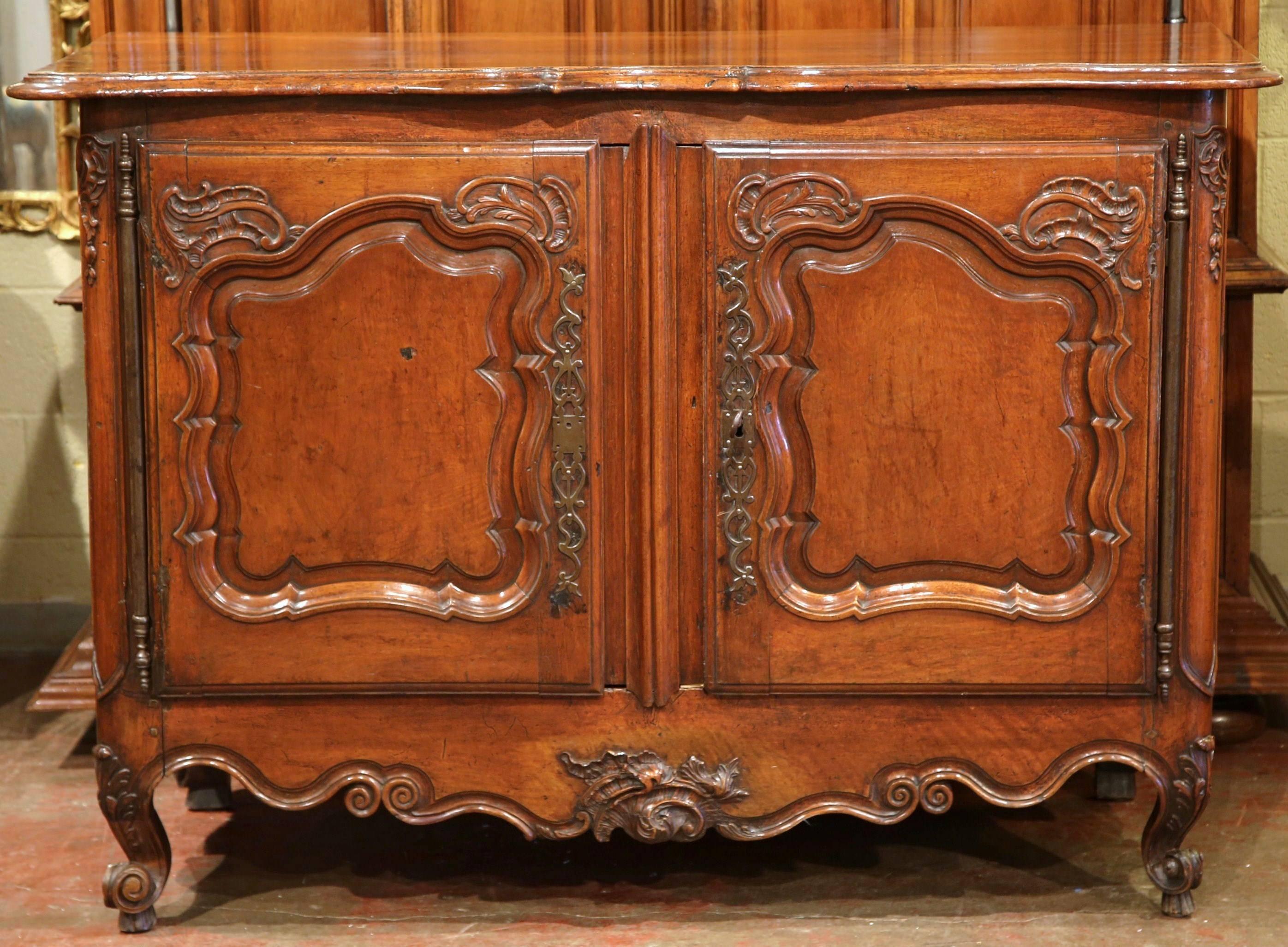 This exceptional, antique fruitwood buffet would make a wonderful, useful addition to a living room or dining room. Crafted in France, circa 1760, the cabinet offers not only museum quality beauty, but functionality and storage space as well. The