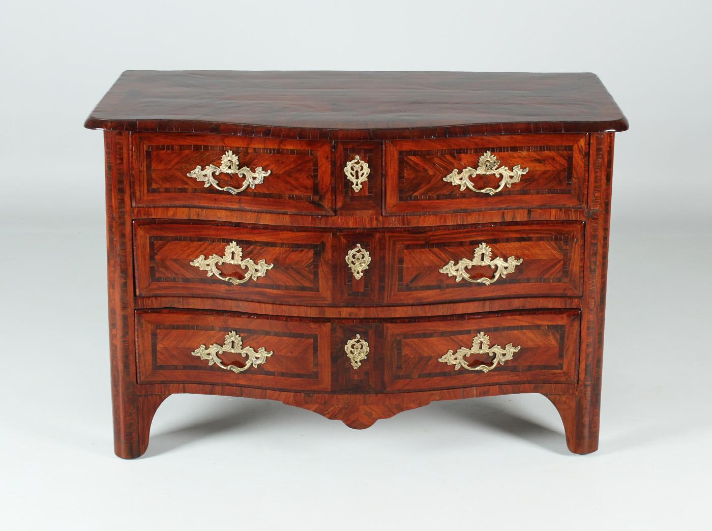 Antique French Louis XV or Baroque Commode

France
Rosewood
Louis XV around 1740

Dimensions: H x W x D: 83 x 121 x 64 cm

Description:
French four-bay chest of drawers from the middle of the 18th century.

Piece of furniture standing on stud feet