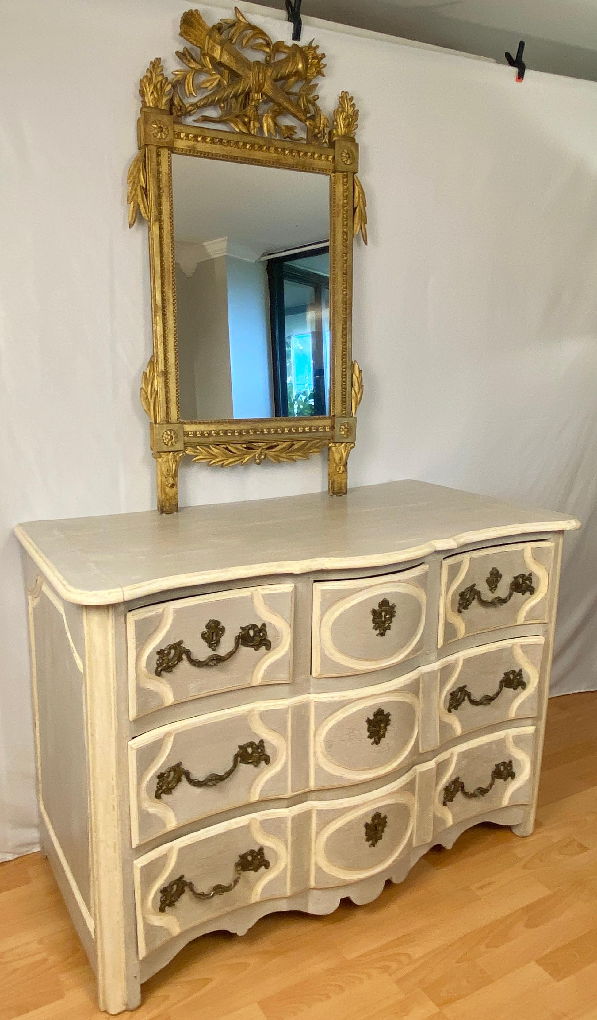 A fine 18th Century French Louis XV Commode with a Painted Finish.
French Louis XV period five drawer commode with blue and grey tones and antique white painted finish. This beautiful commode is a wonderful scale and has a great patina. It features