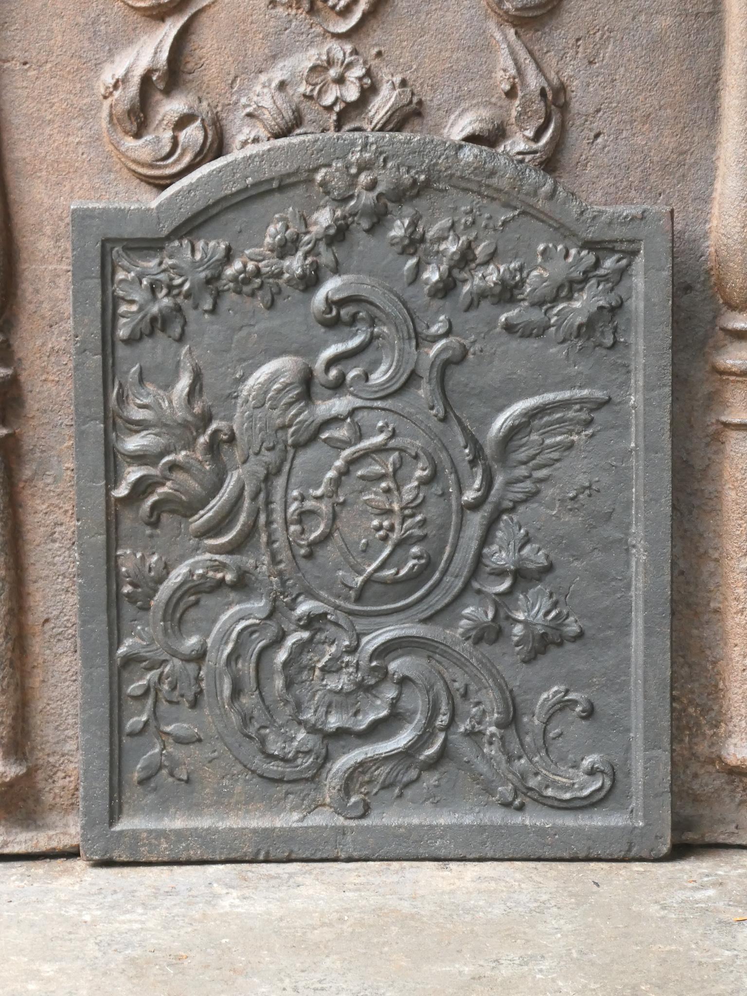 18th century French Louis XV period fireback. The fireback is made of cast iron and has a black / pewter patina. The condition is good, no cracks.