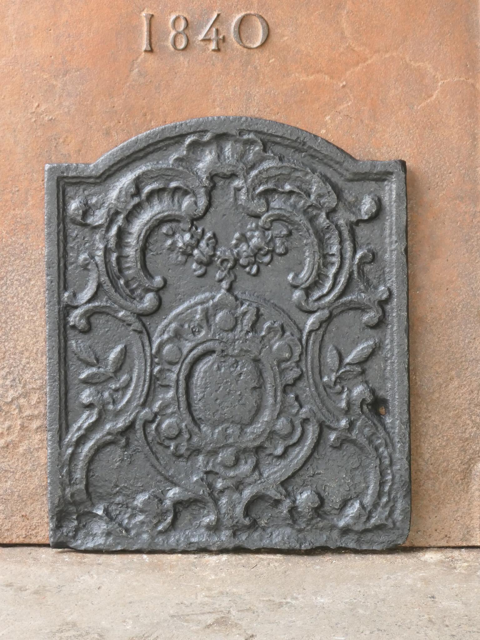 18th Century French Louis XV period fireback. The fireback is made of cast iron and has black / pewter patina. The condition is good, no cracks.