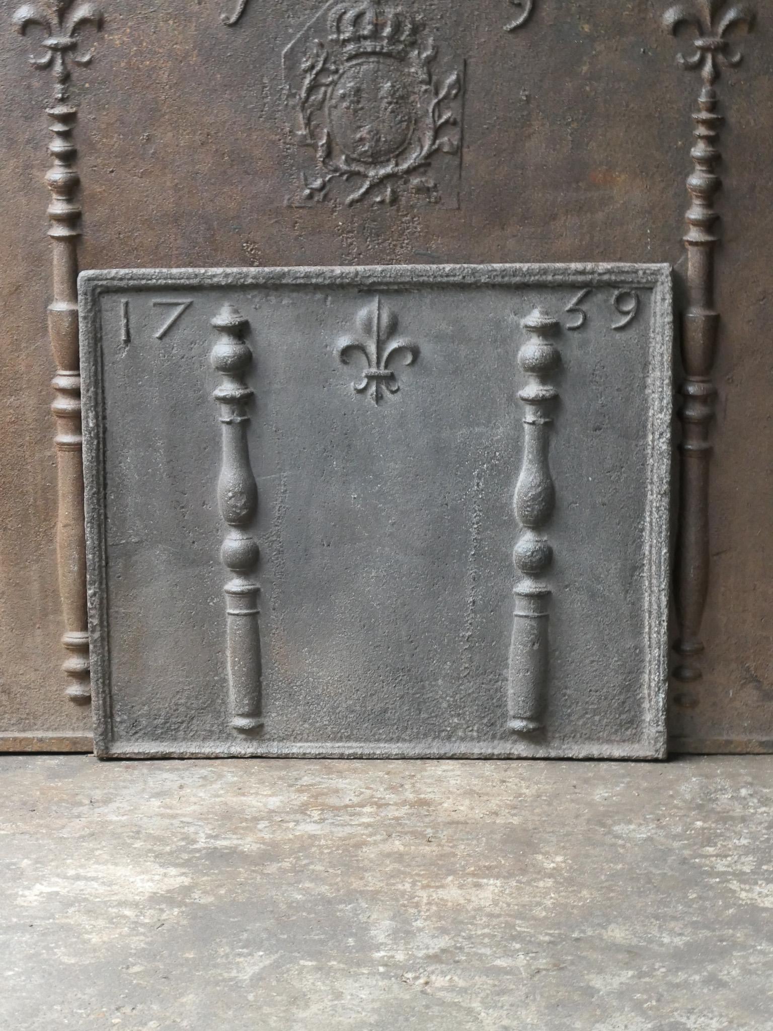 Beautiful 18th century French Louis XV fireback with pillars and Fleur de Lys. The Fleur de Lys (French Lily) symbolized royalty and aristocracy throughout Europe. The pillars stand for the club of Hercules and symbolize strength and the unknown.