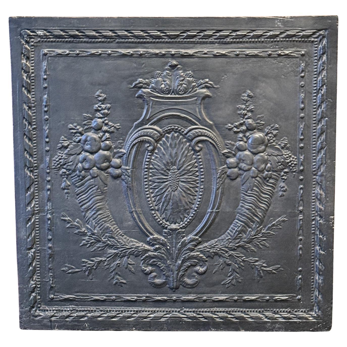 What is a fireplace back plate?