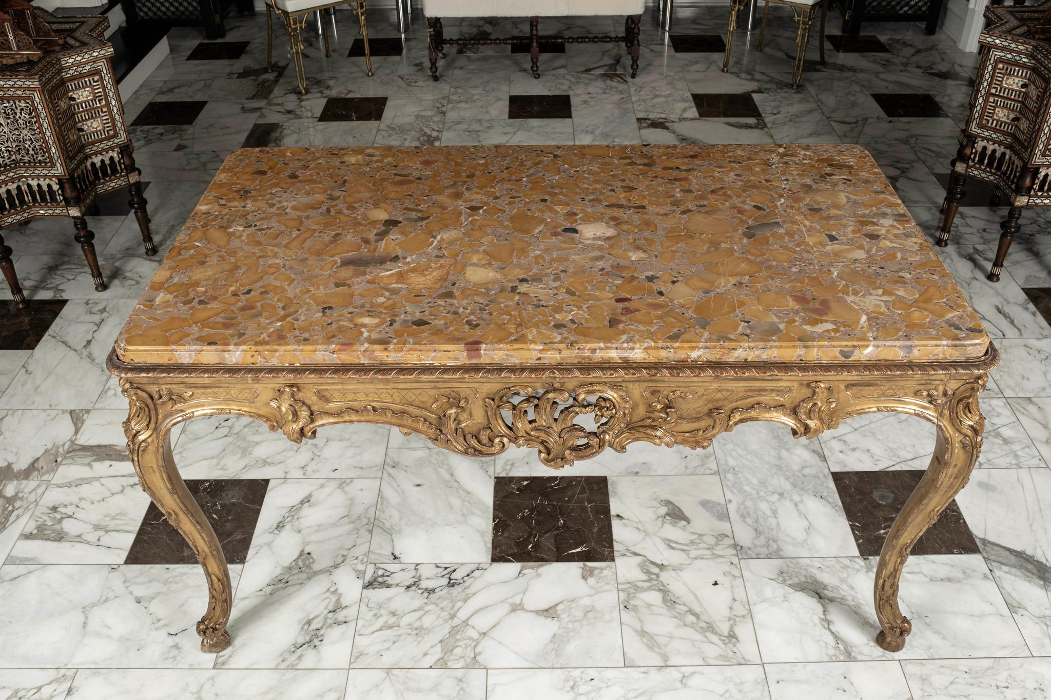 A magnificent 18th century Louis XV center table with original Beccia marble top.