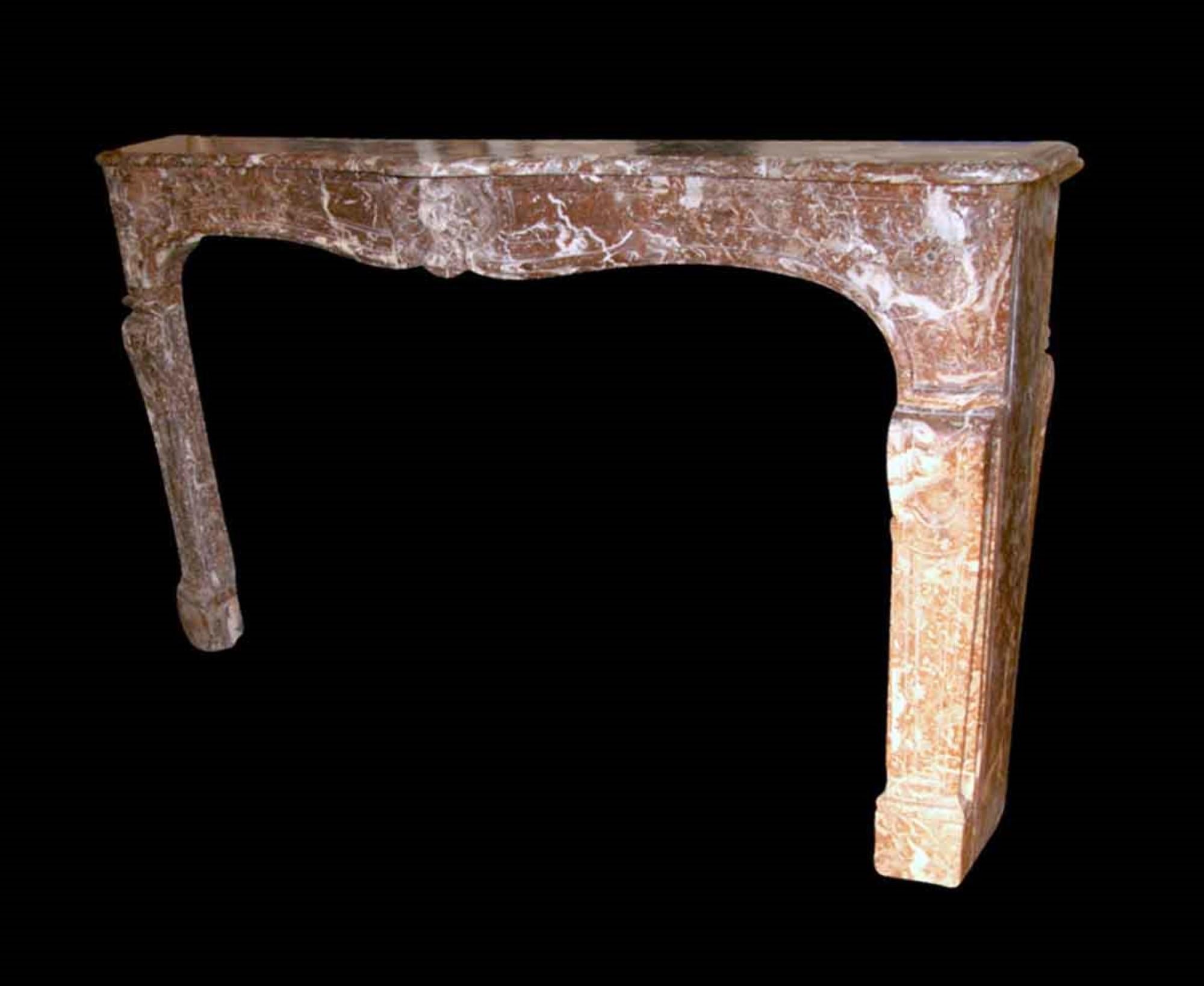 Hand carved French Louis XV period rouge royale marble mantel with flower detail from the 18th century. Several repairs have been don't to the shelf. This is one of many acquisitions from Danny Alessandro & Edwin Jackson mantel company. This can be