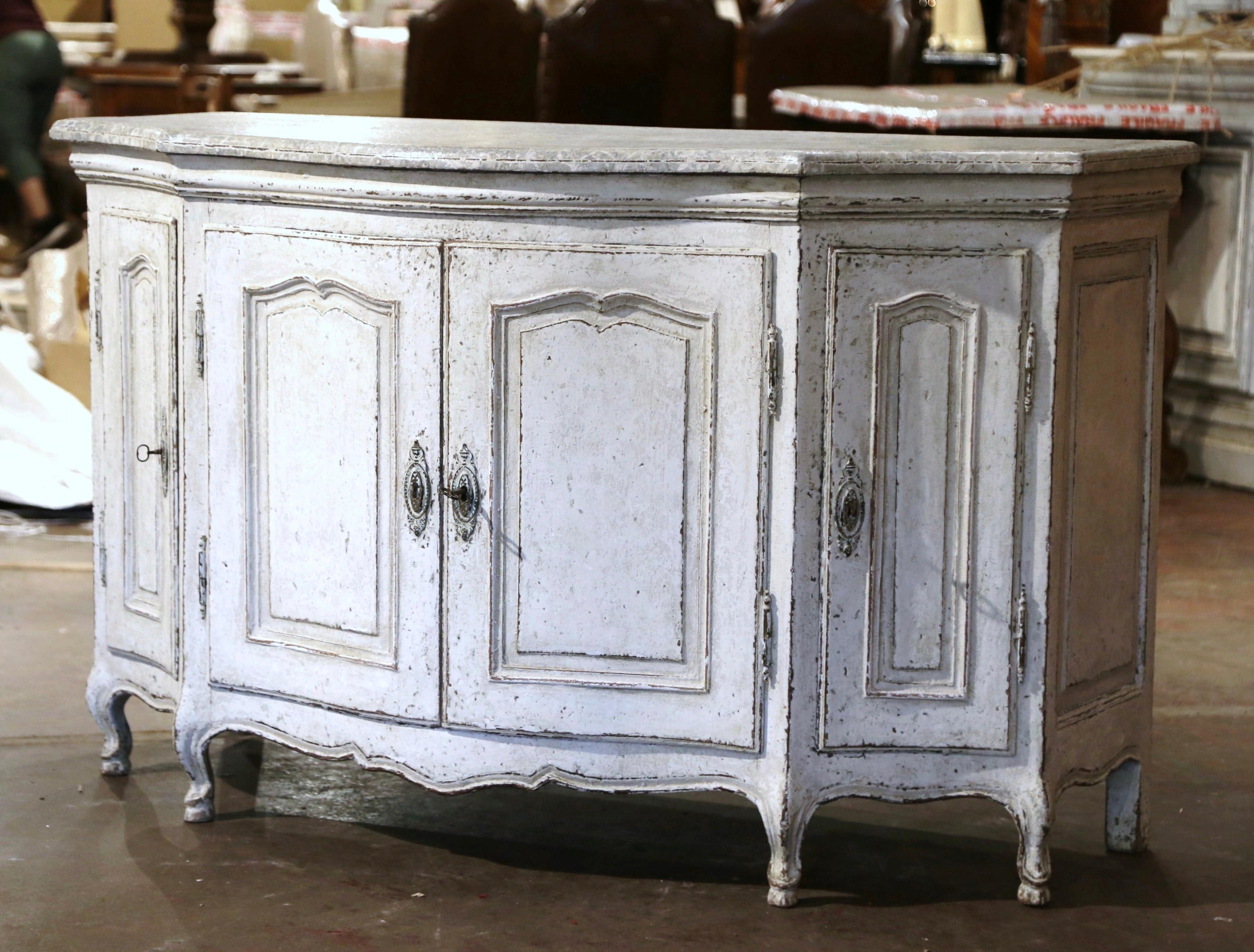 Add extra surface space and storage to a living room with this elegant, antique carved “Buffet de Chasse” or 