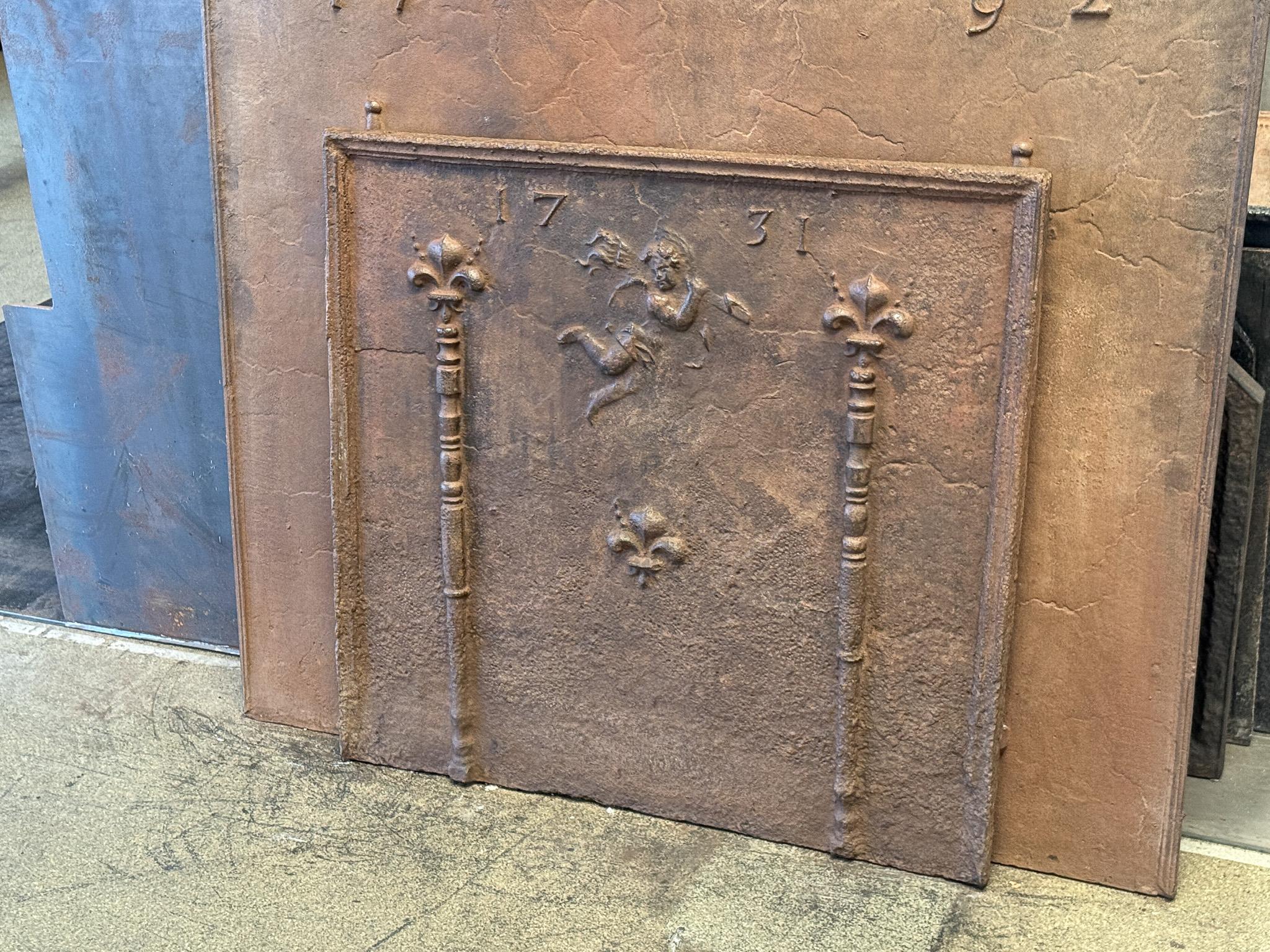 18th Century and Earlier 18th Century French Louis XIV Period 'Cupid' Fireback / Backsplash For Sale