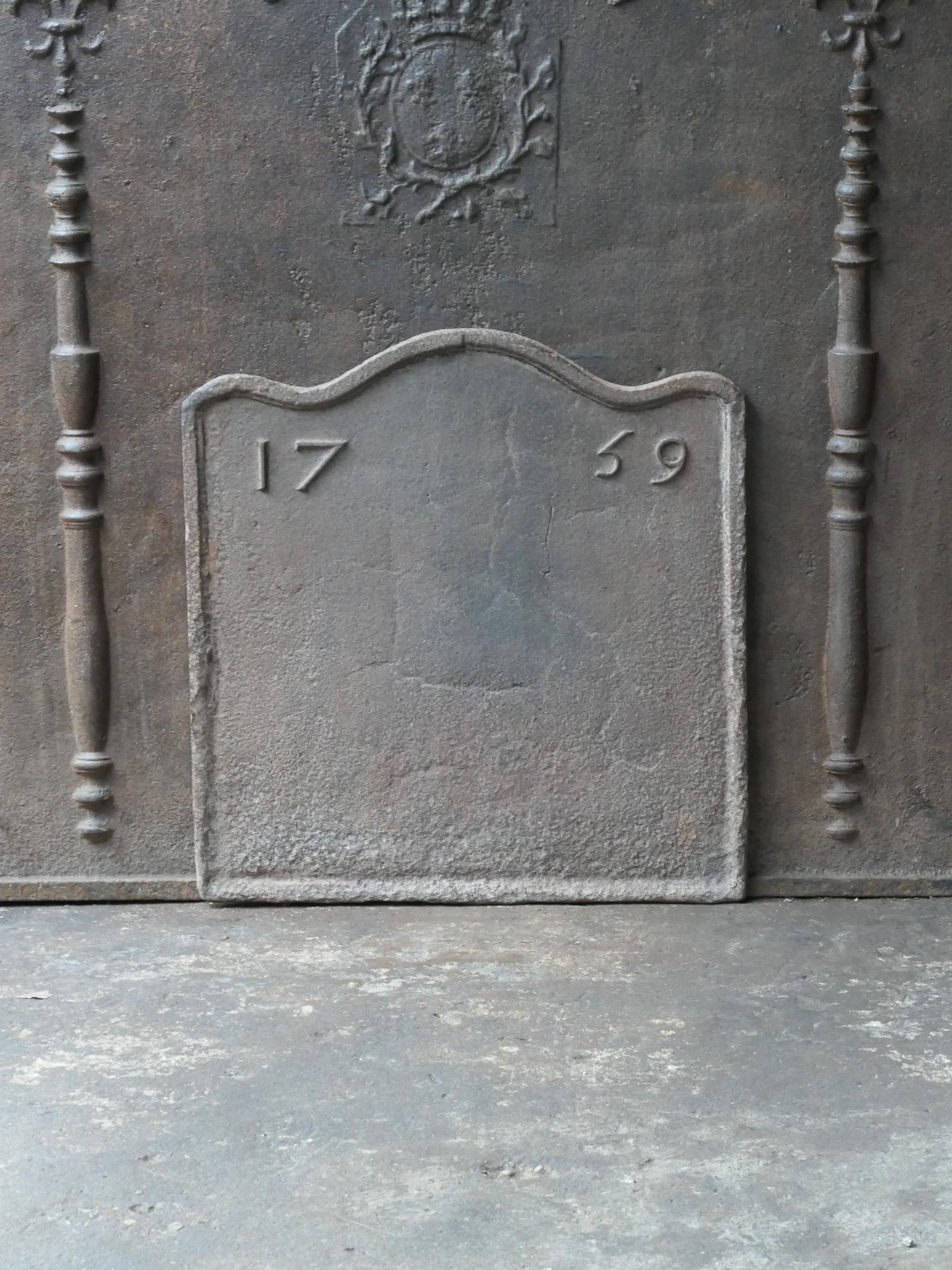 18th century French Louis XV period fireback. The date of production, 1759, is cast in the fireback.

The fireback has a natural brown patina. Upon request it can be made black / pewter colored at no extra cost. The fireback is in a good condition
