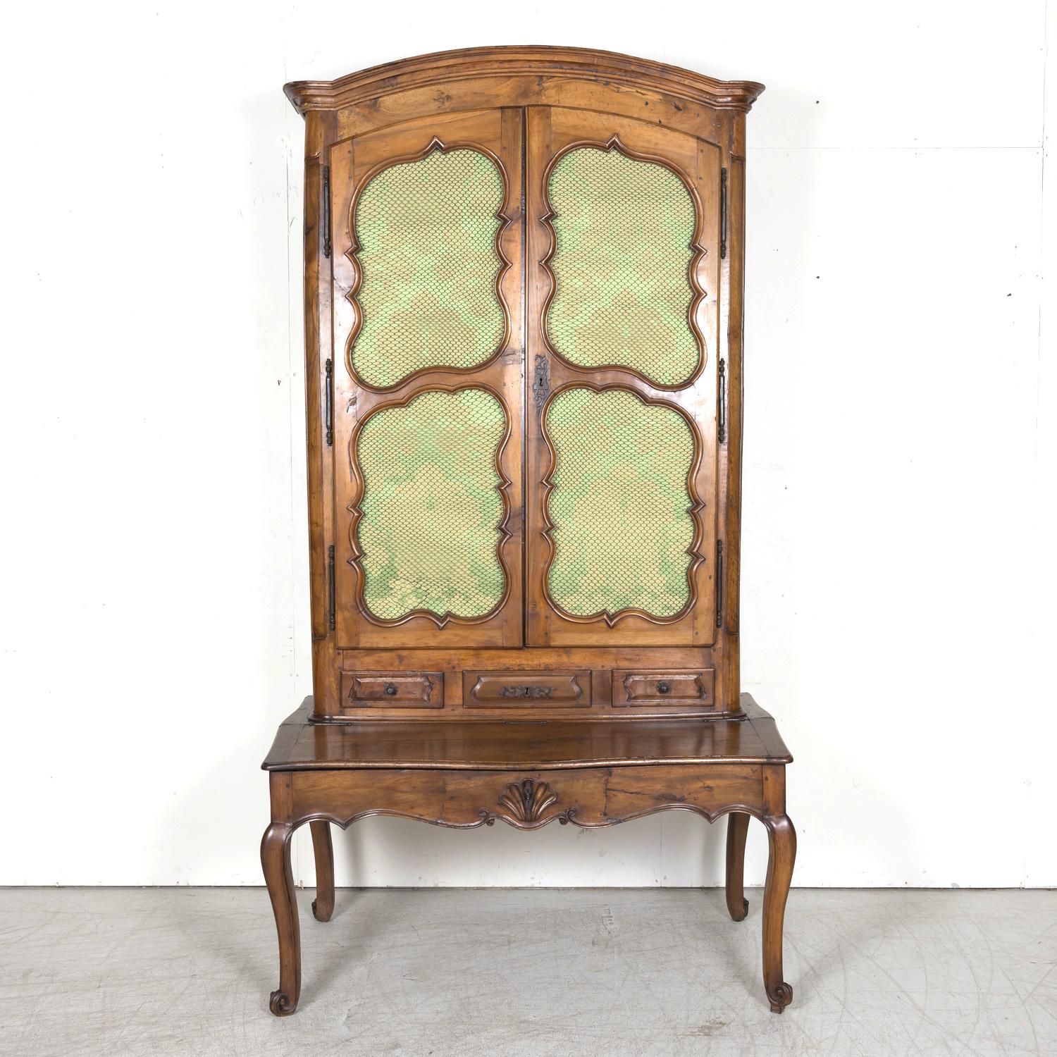 A rare 18th century French Louis XV period chateau bonheur du jour or secrétaire handcrafted of walnut by very talented artisans in Lyon for a wealthy chateau owner near Villeurbanne, circa 1750s. This impressive antique French secretary features a