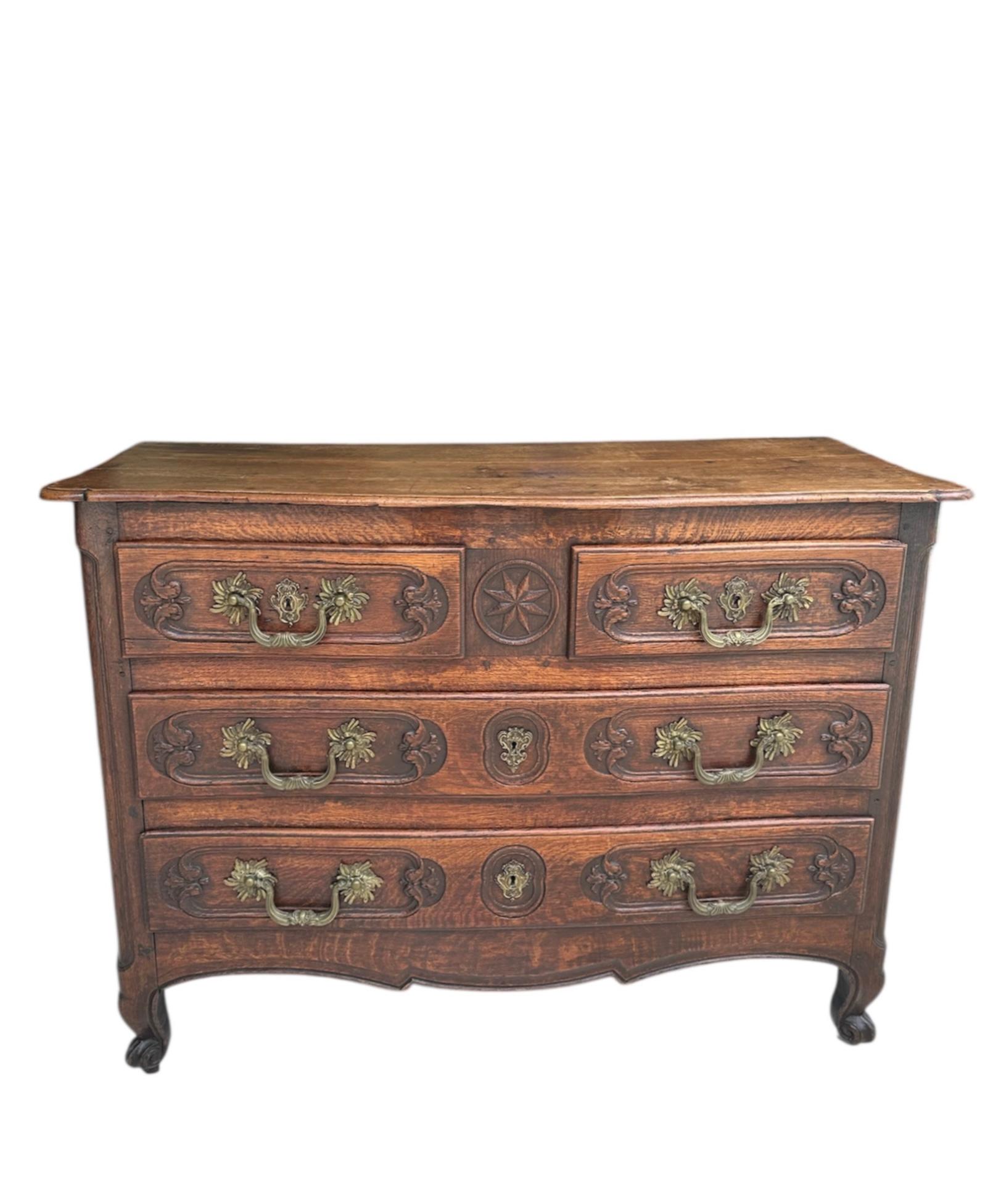 18th Century French Louis XV Walnut and Oak Chest of Drawers

Superb 18th century serpentine commode. The case is fitted with two small and two large drawers. It is raised on short cabriole legs over a scalloped apron. The front facade is