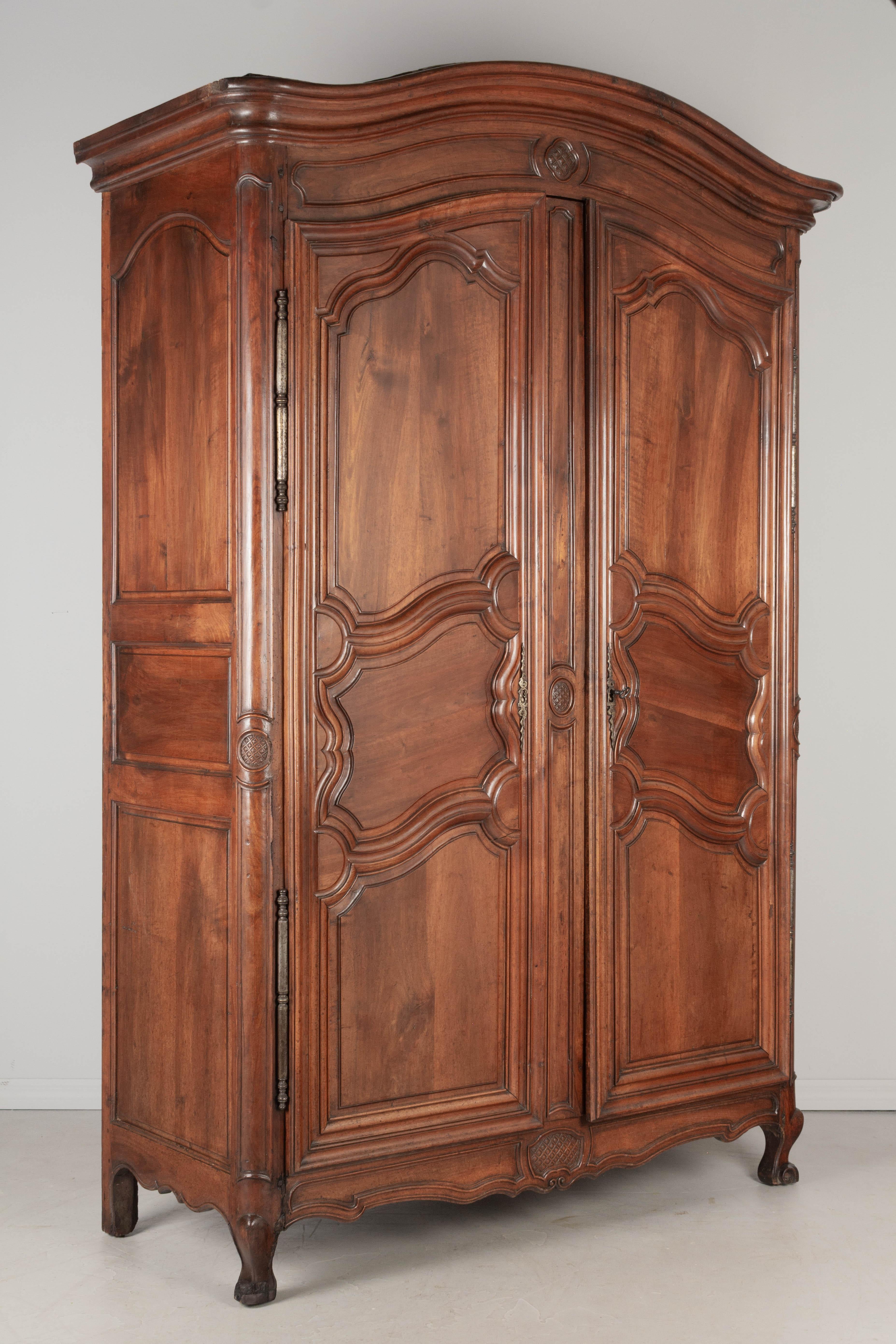 Hand-Carved 18th Century French Louis XV Walnut Armoire For Sale
