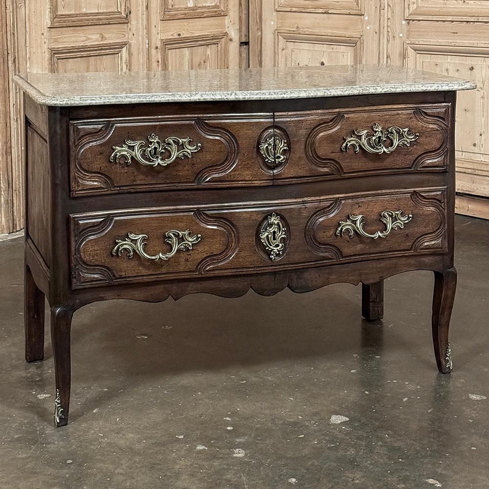 18th Century French Louis XV Walnut Marble Top Commode combines elegance, premier craftsmanship and timeless hand-selected materials to create a special piece your family will consider an instant heirloom!  Sumptuous French walnut has achieved an