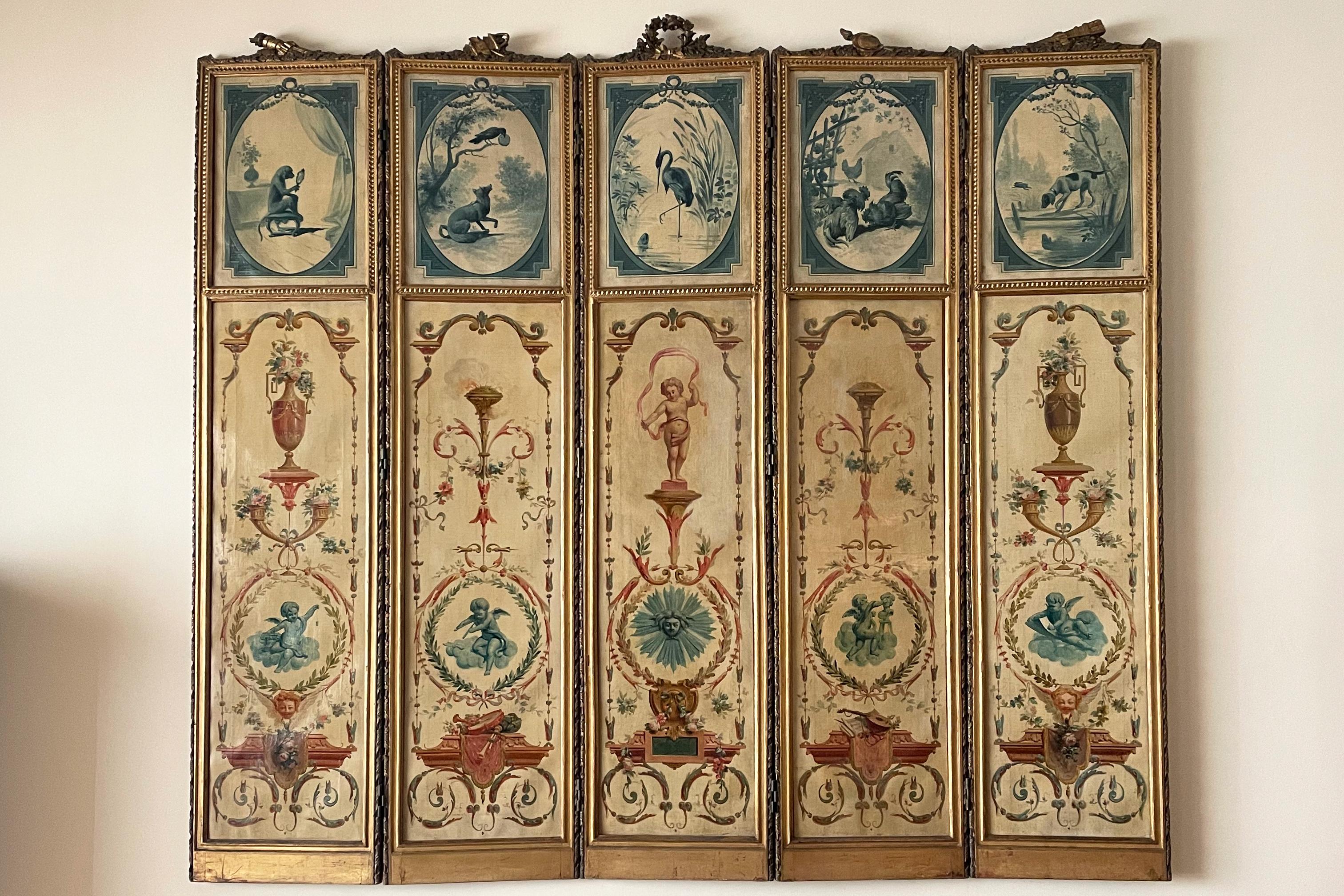 A remarkable Louis XVI 18th-century French antique screen with an illustrious provenance, presumed to have belonged to the Duke of Uzès. This exquisite five-panel folding screen showcases hand painted oil on canvas artwork framed in gilded wood,