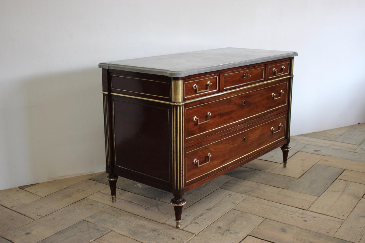 A good quality and with a lovely colour, late 18th century French Louis XVI brass-mounted mahogany commode, retaining the original St Anns marble top.
 