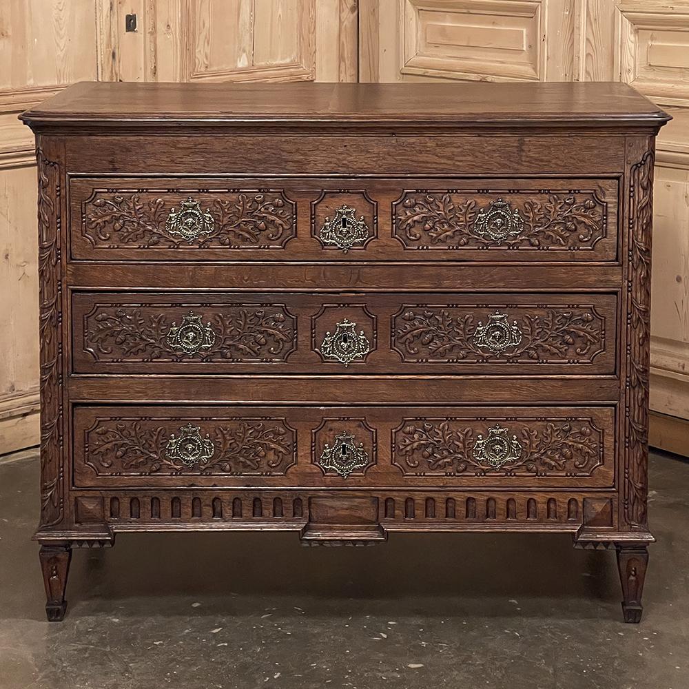 18th Century French Louis XVI Commode is a magnificent example of the genre, meticulously hand-crafted by master artisans in the neoclassical revival style from dense, old-growth oak. The tailored rectilinear architecture recalls the glory years of