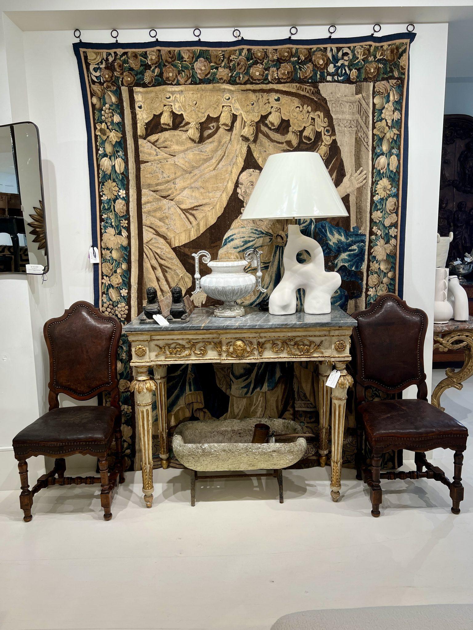 This stunning console, dating back to the late 18th century, hails from France and embodies the quintessential characteristics of the Louis XVI style. Crafted with meticulous attention to detail, the console features a finely carved wooden frame,